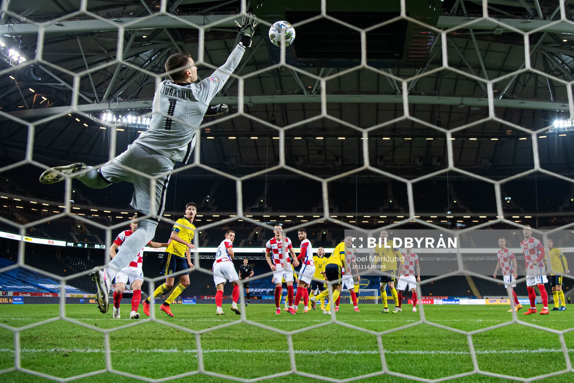 Goalkeeper Dominik Livakovic of Croatia saves the ball