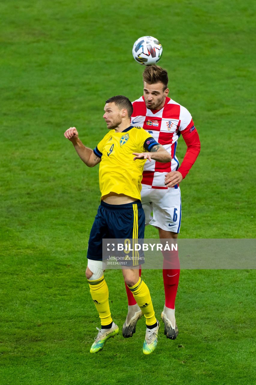 Marcus Berg of Sweden and Marin Pongracic of Croatia