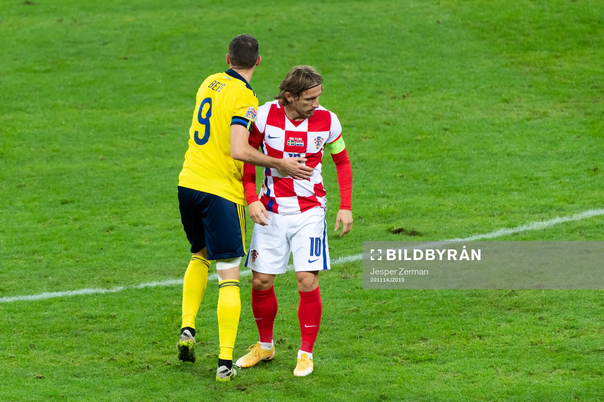 Marcus Berg of Sweden and Luka Modric of Croatia