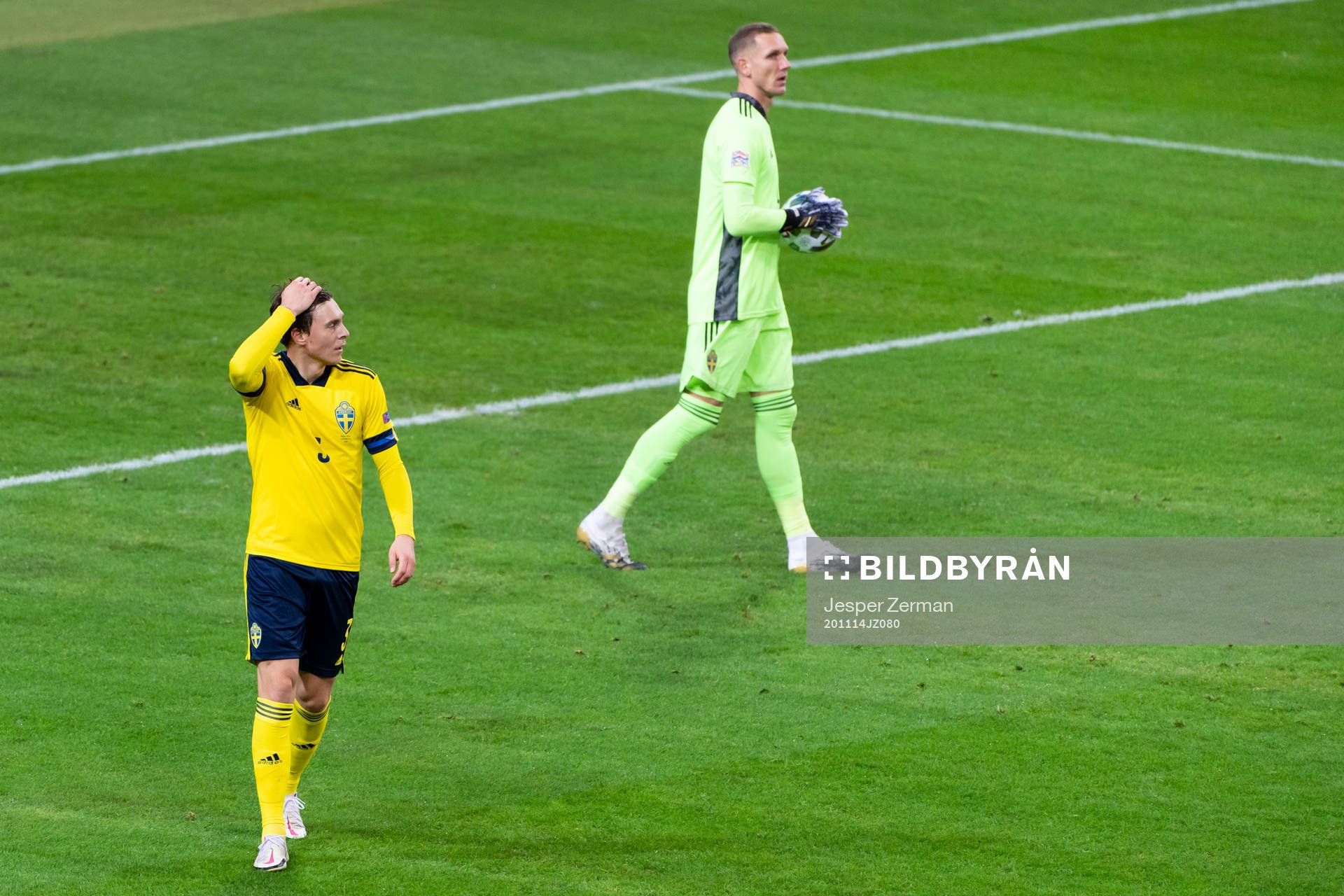 Victor Nilsson Lindelöf and goalkeeper Robin Olsen of