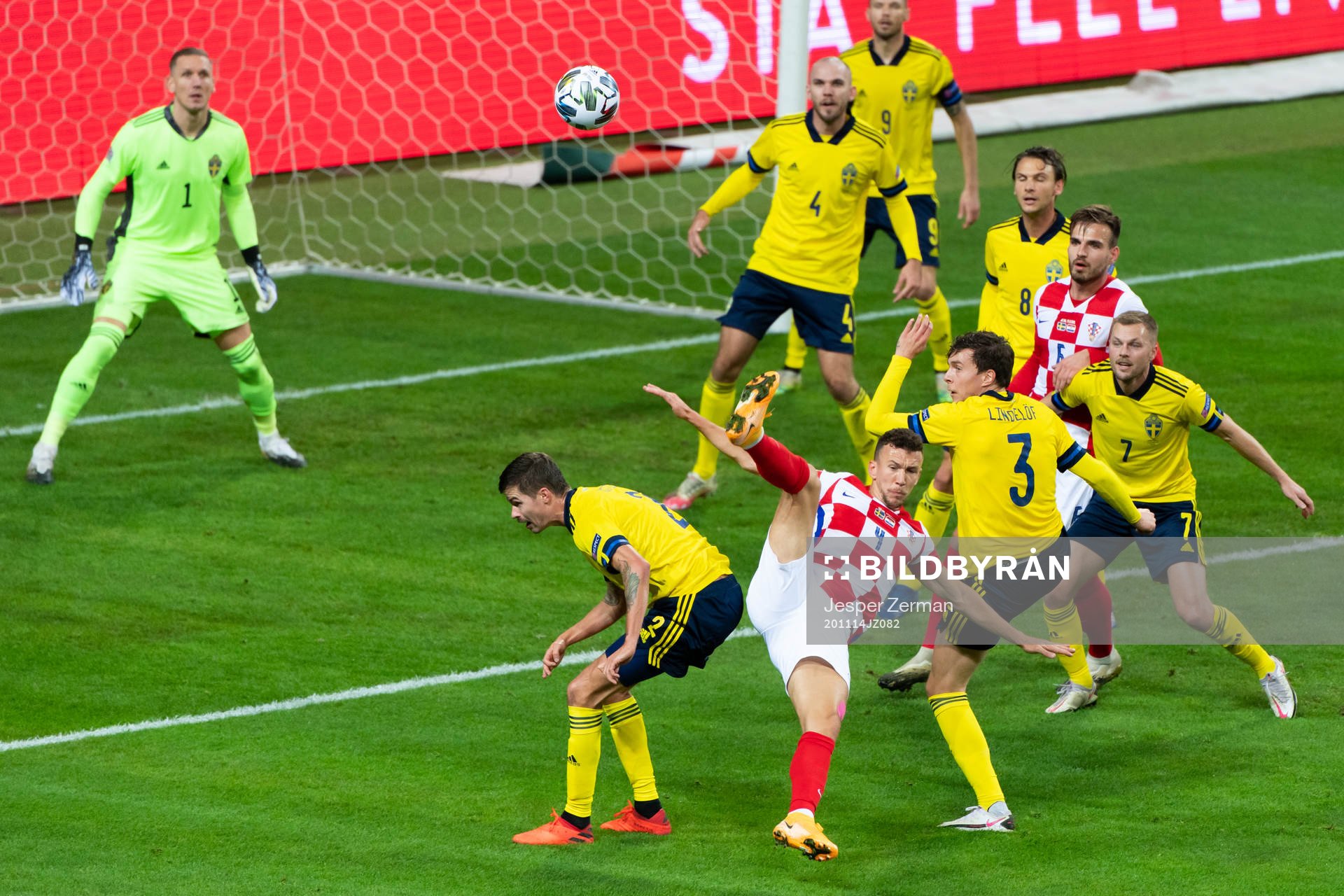 Mikael Lustig of Sweden and Ivan Perisic of Croatia