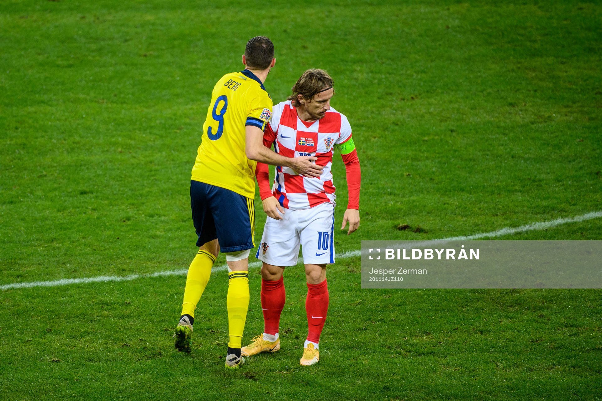Marcus Berg of Sweden and Luka Modric of Croatia