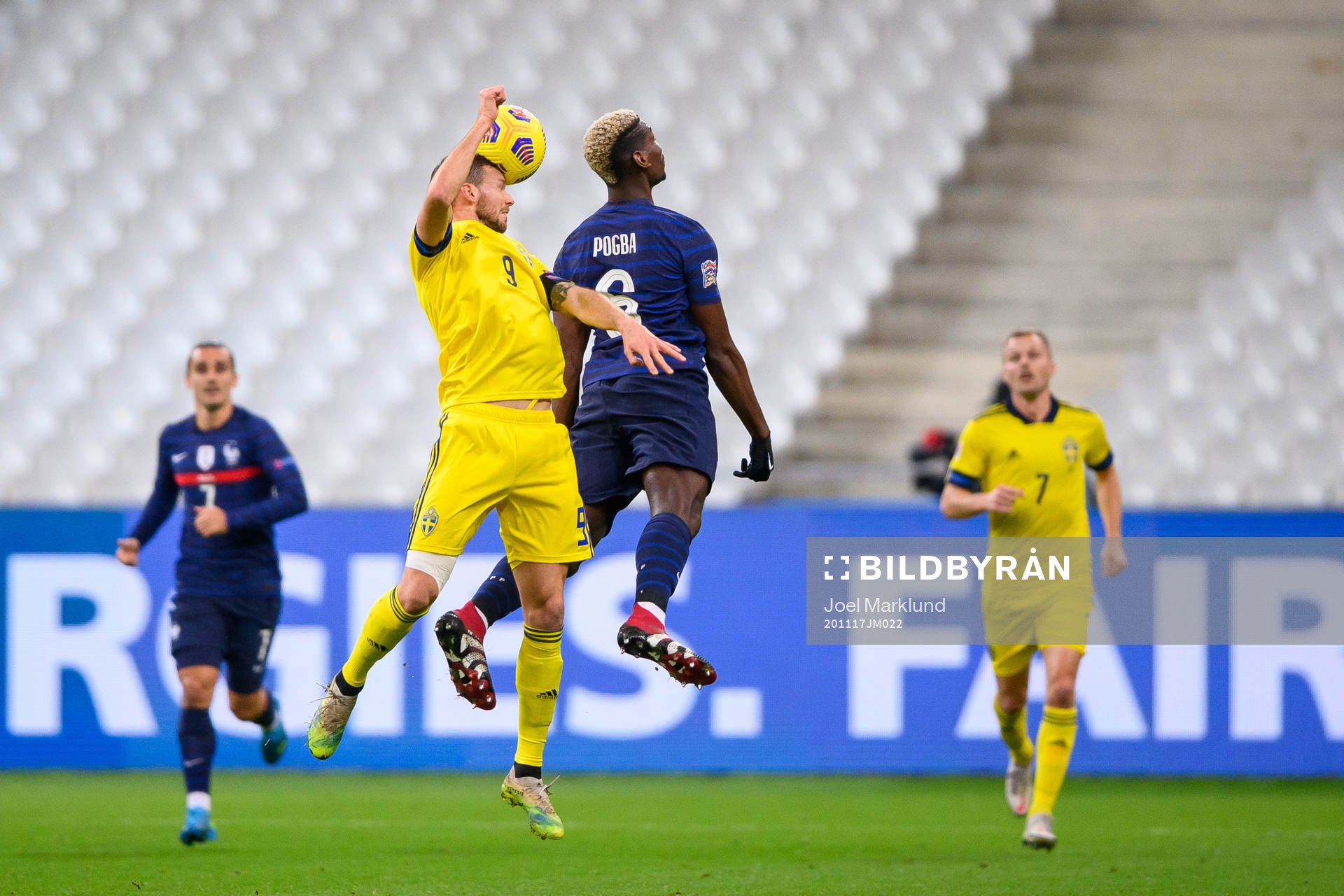 Marcus Berg of Sweden and Paul Pogba of France
