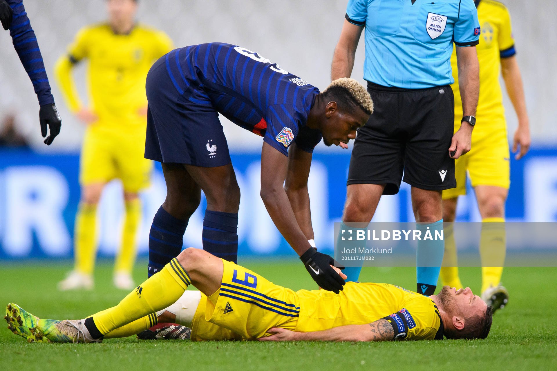 Paul Pogba of France and Marcus Berg of Sweden