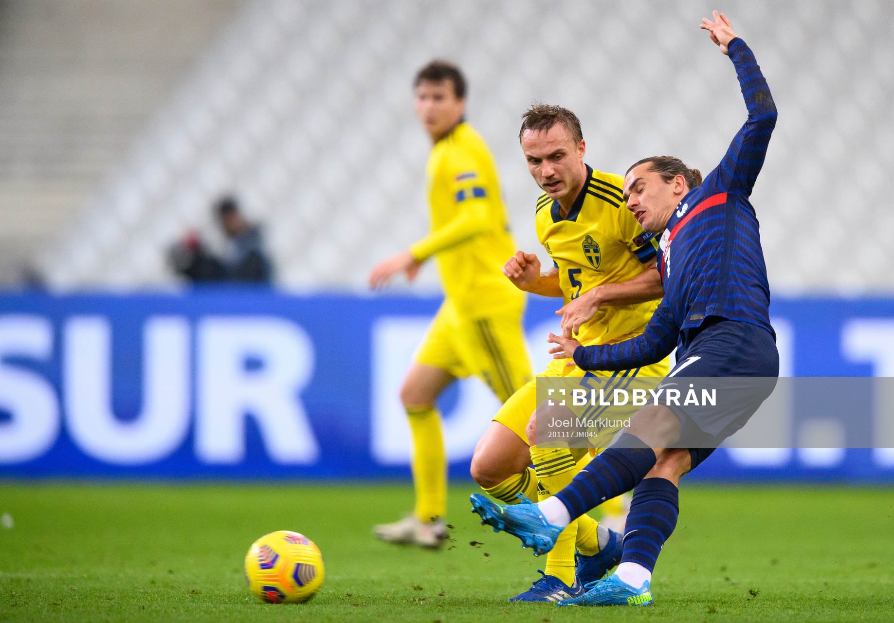 Pierre Bengtsson of Sweden and Antoine Griezmann of France