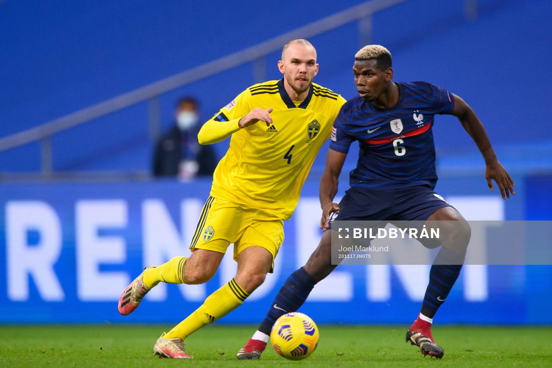 Marcus Danielson of Sweden and Paul Pogba of France