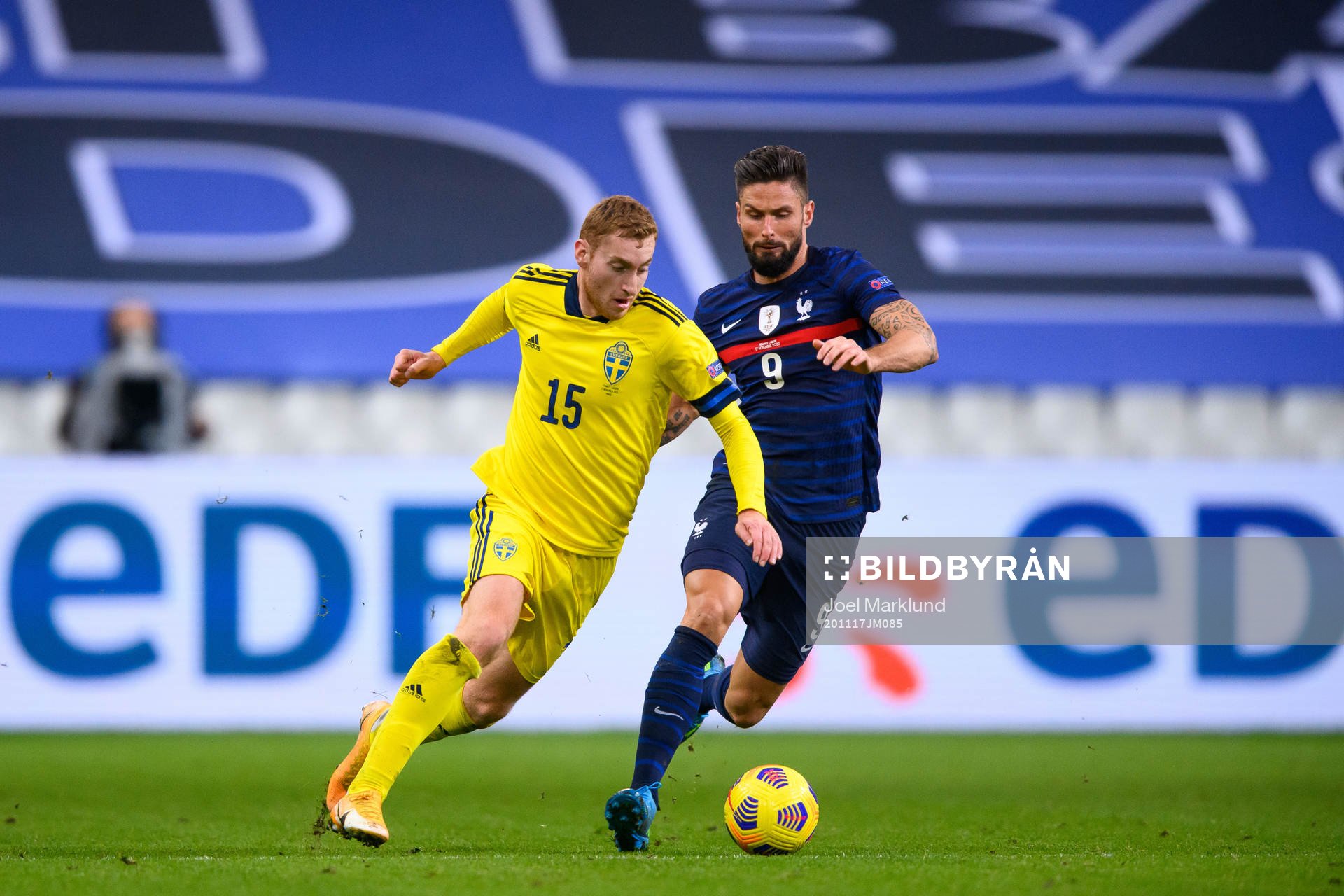 Dejan Kulusevski of Sweden and Olivier Giroud of France