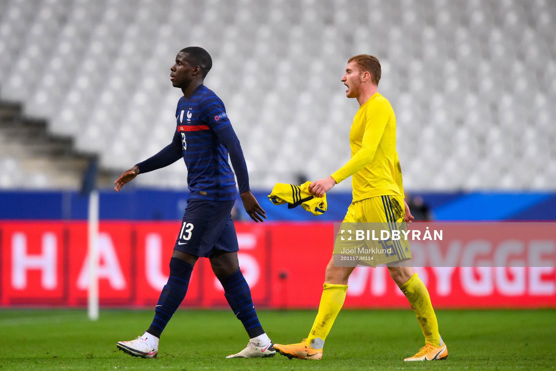 Kurt Zouma of France and Dejan Kulusevski of Sweden look