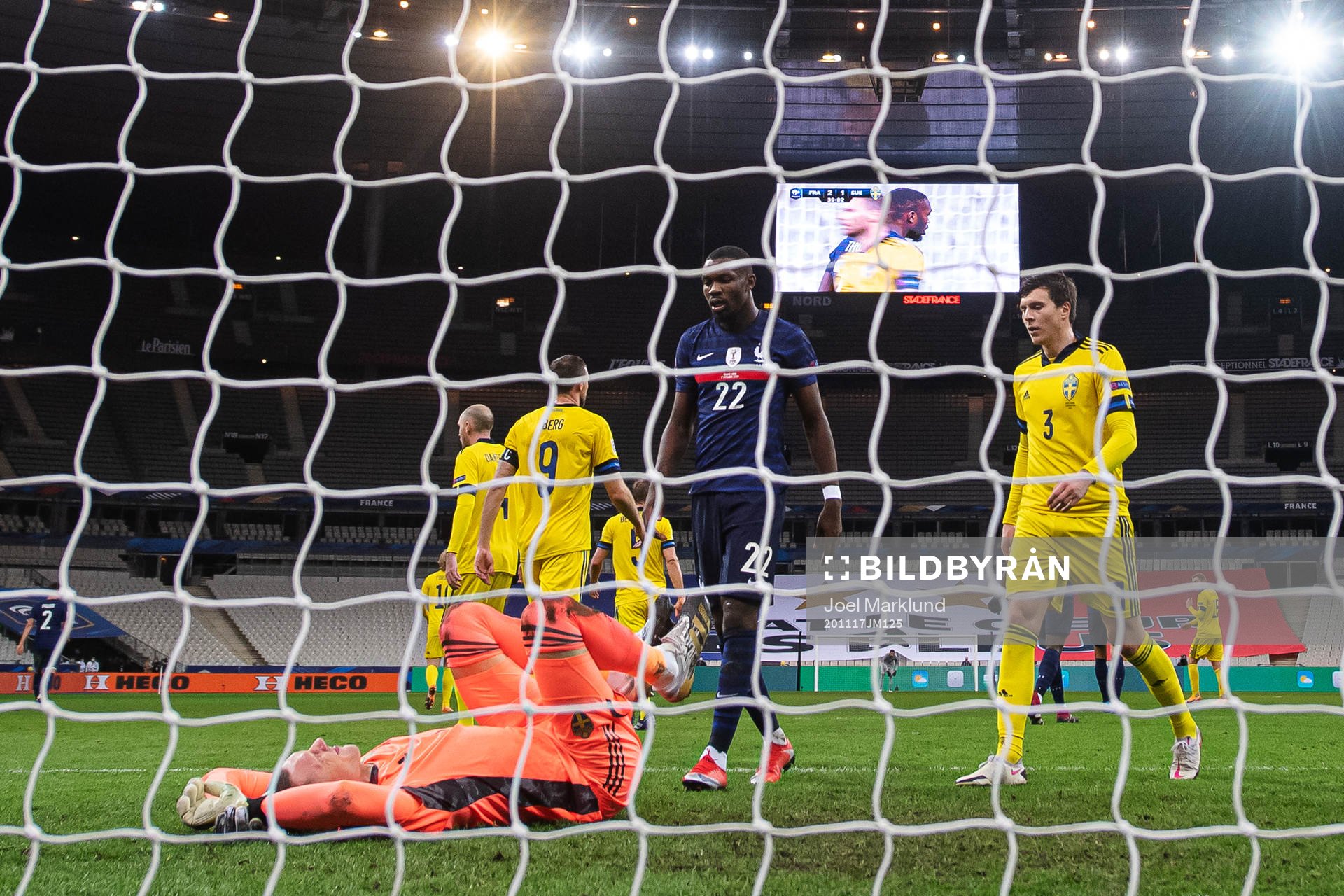 Goalkeeper Robin Olsen of Sweden, Marcus Thuram of France