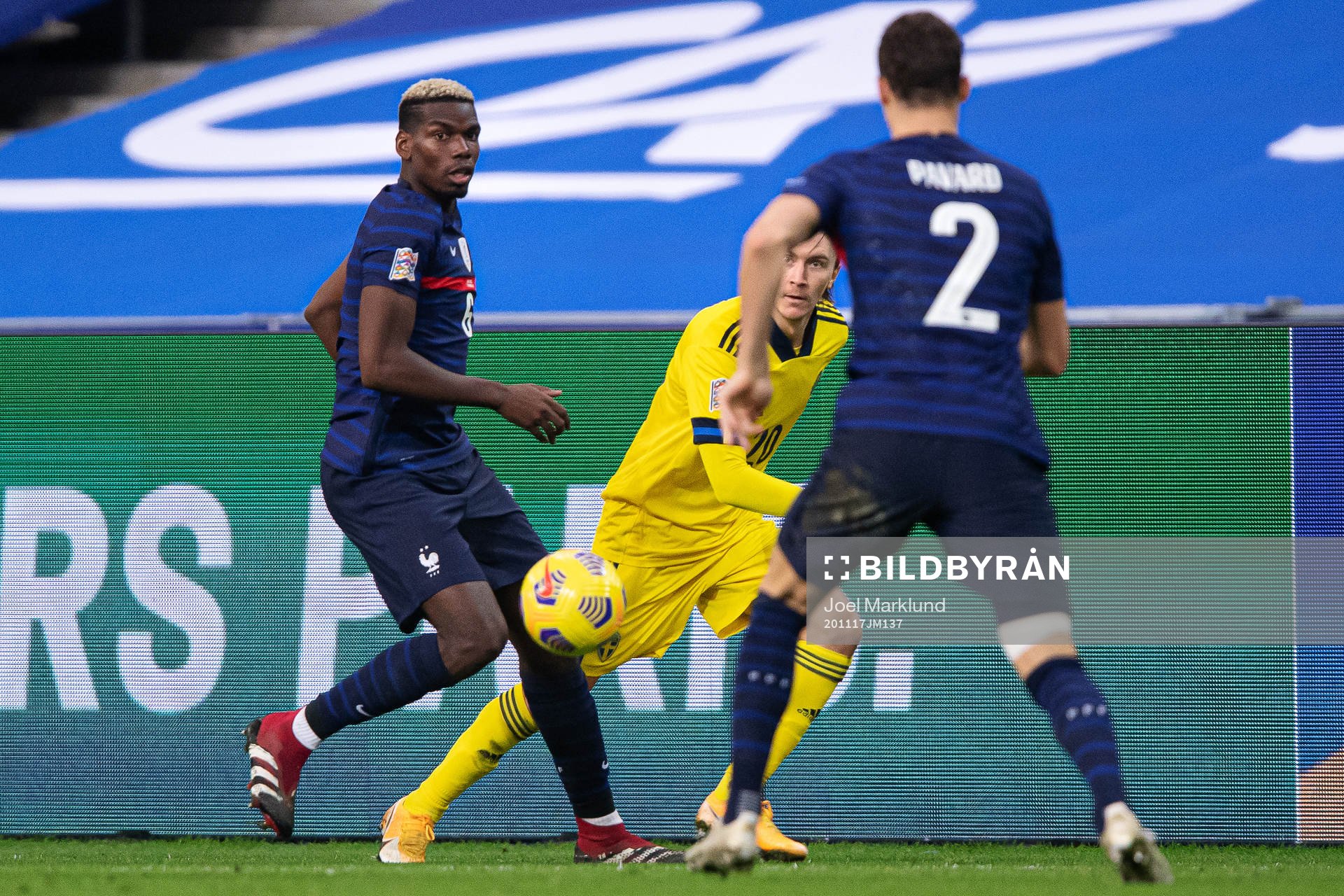 Paul Pogba and Benjamin Pavard of France against Kristoffer
