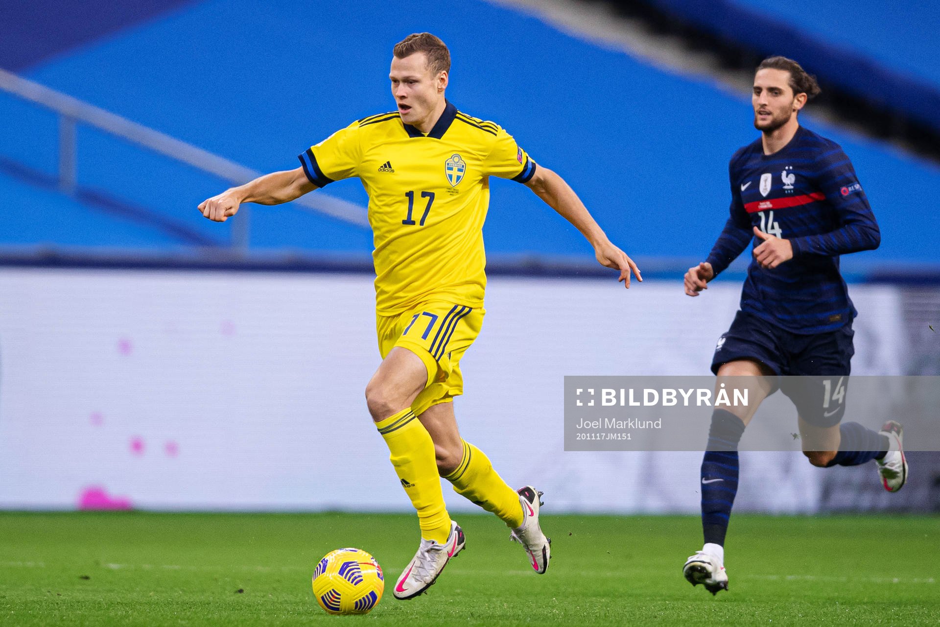 Viktor Claesson of Sweden in front of Adrien Rabiot of