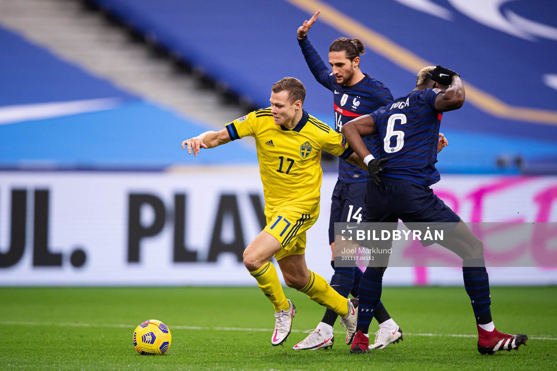 Viktor Claesson of Sweden breaks through Adrien Rabiot and