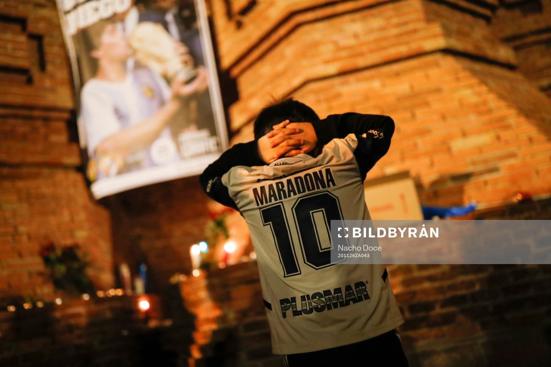 A fan gestures as he pays tribute to late Argentine soccer