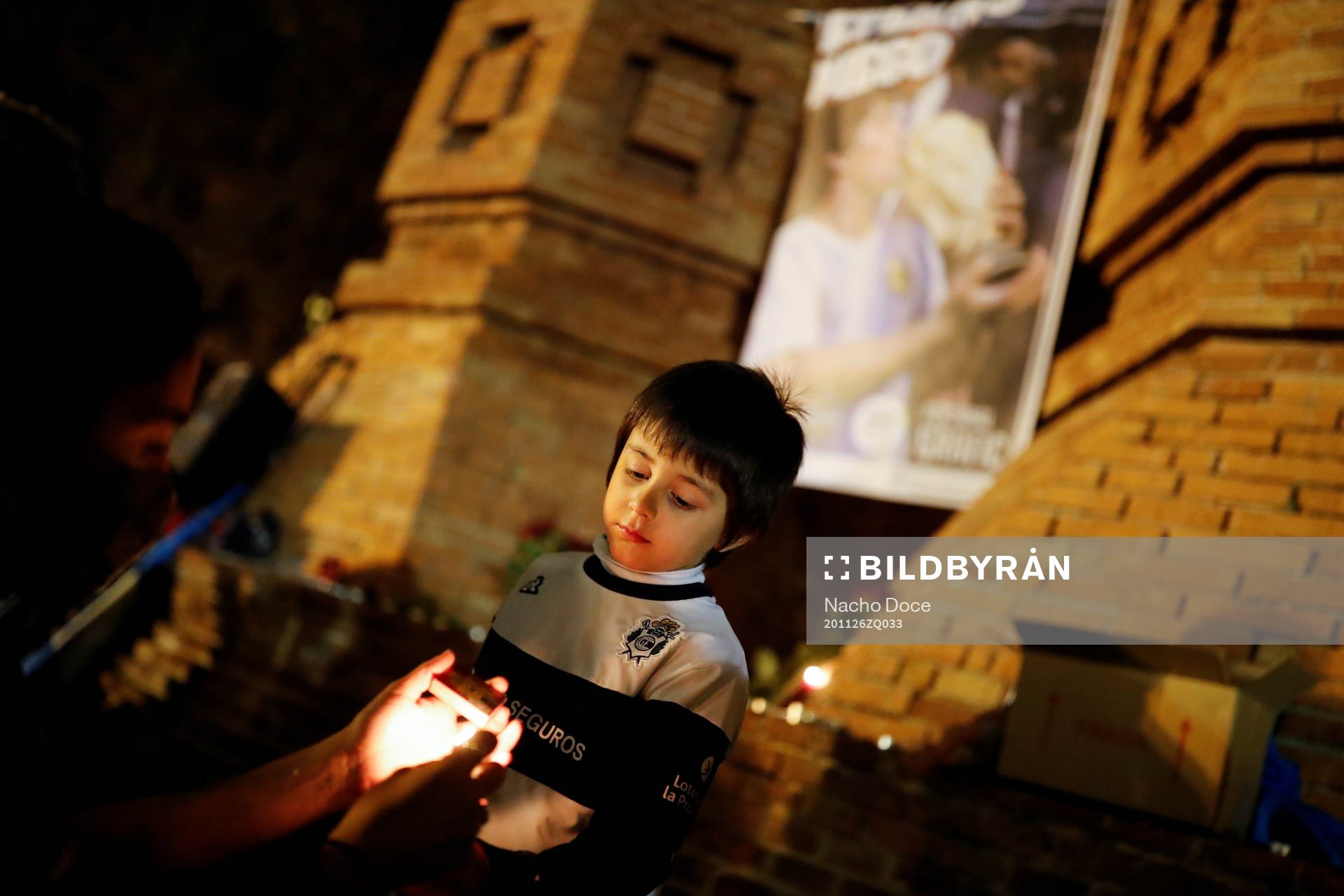 Five years old Inaki Gonzalez Reynoso, who was born in Argentina, participates on a tribute to late Argentine soccer legend Diego Armando Maradona the day after his death, in Barcelona, Spain, November 26, 2020. REUTERS/Nacho Doce