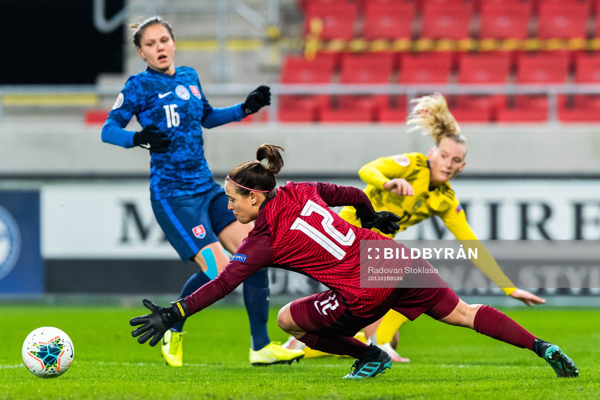 Goalkeeper 12 Maria Korenčiová of Slovakia saves a shot