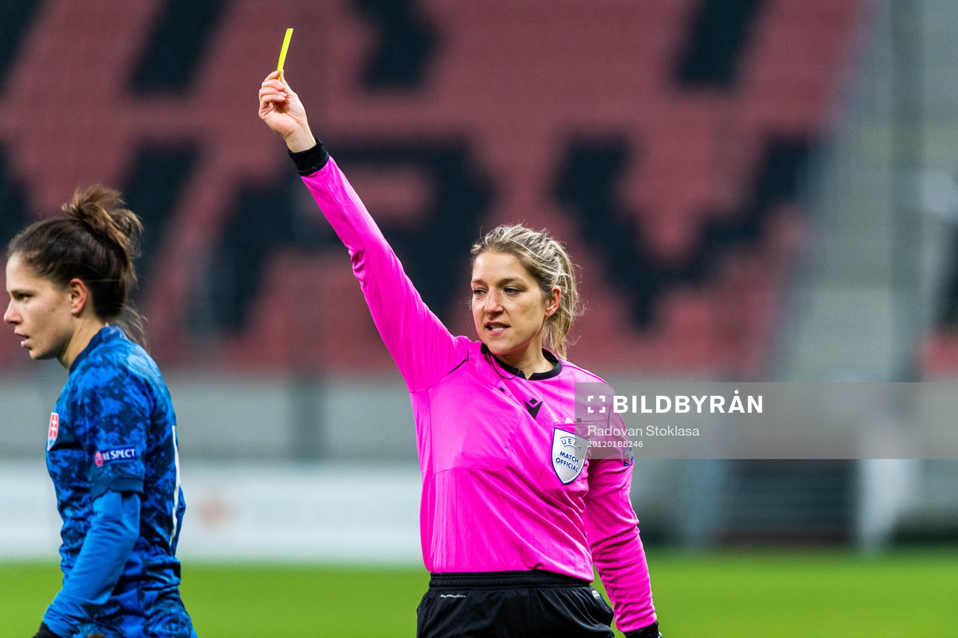 Referee Karoline Wacker awards a yellow card