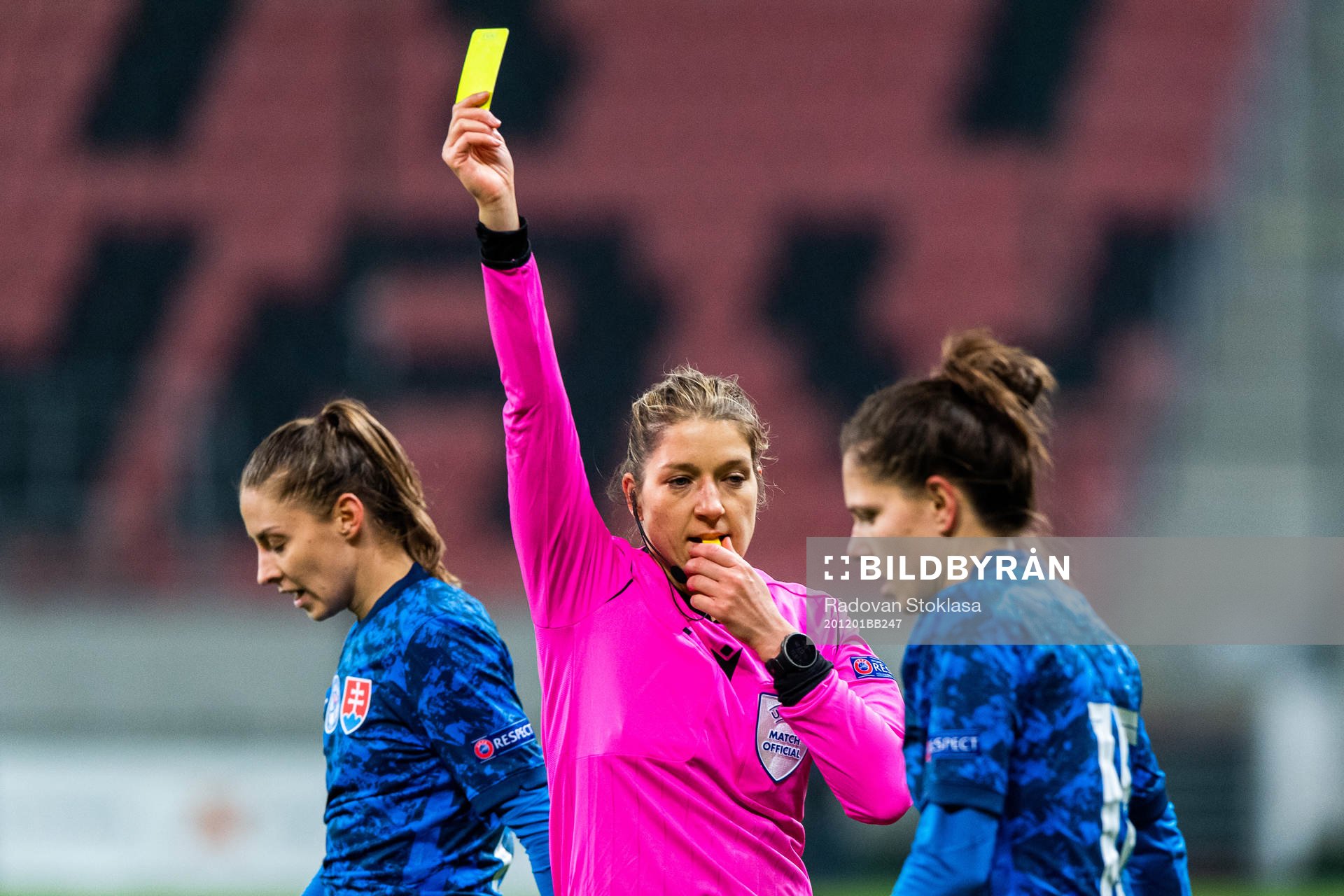Referee Karoline Wacker awards a yellow card