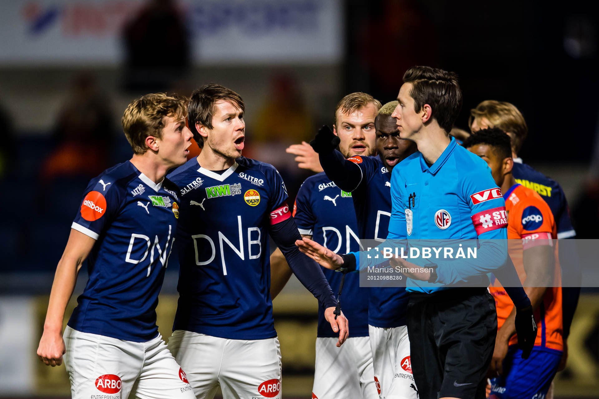 Johan Hove, Lars-Christopher Horst Jan Vilsvik and Moses Dramwi Mawa of Strømsgodset reacts at Sivert Øksnes Amland, referee, at the 0-4 goal situation during the Eliteserien match between Aalesund and Strømsgodset on December 9, 2020 in Ålesund.