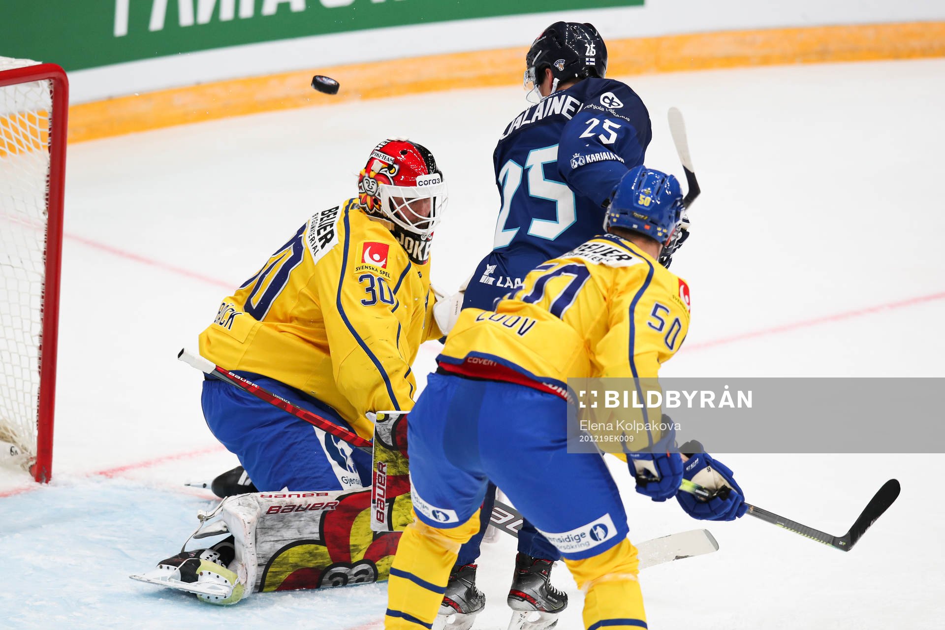 goalkeeper Anders Lindbäck of Sweden, Jere Karjalainen of