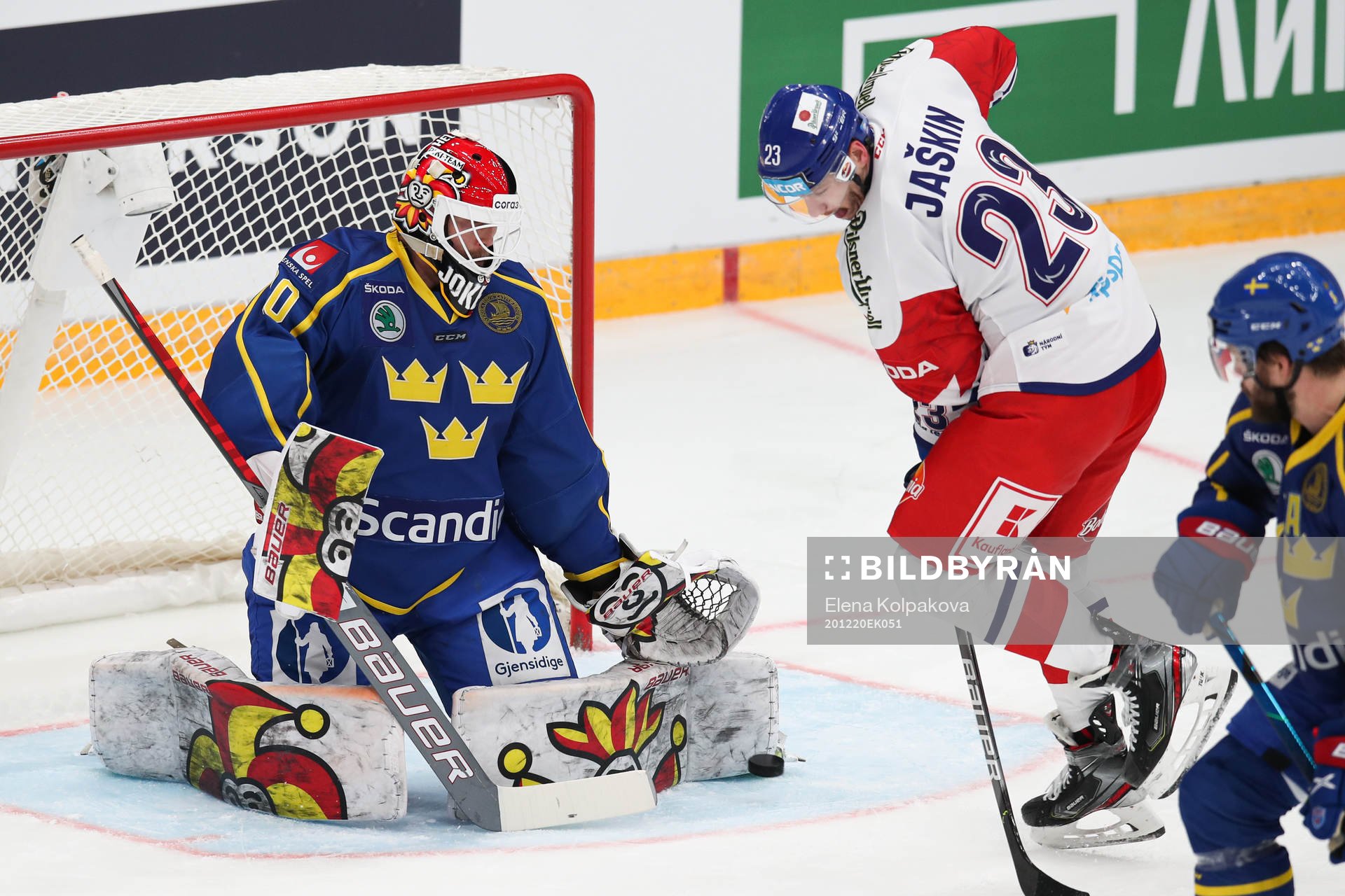 goalkeeper Anders Lindbäck of Sweden and Dmitrij Jaskin
