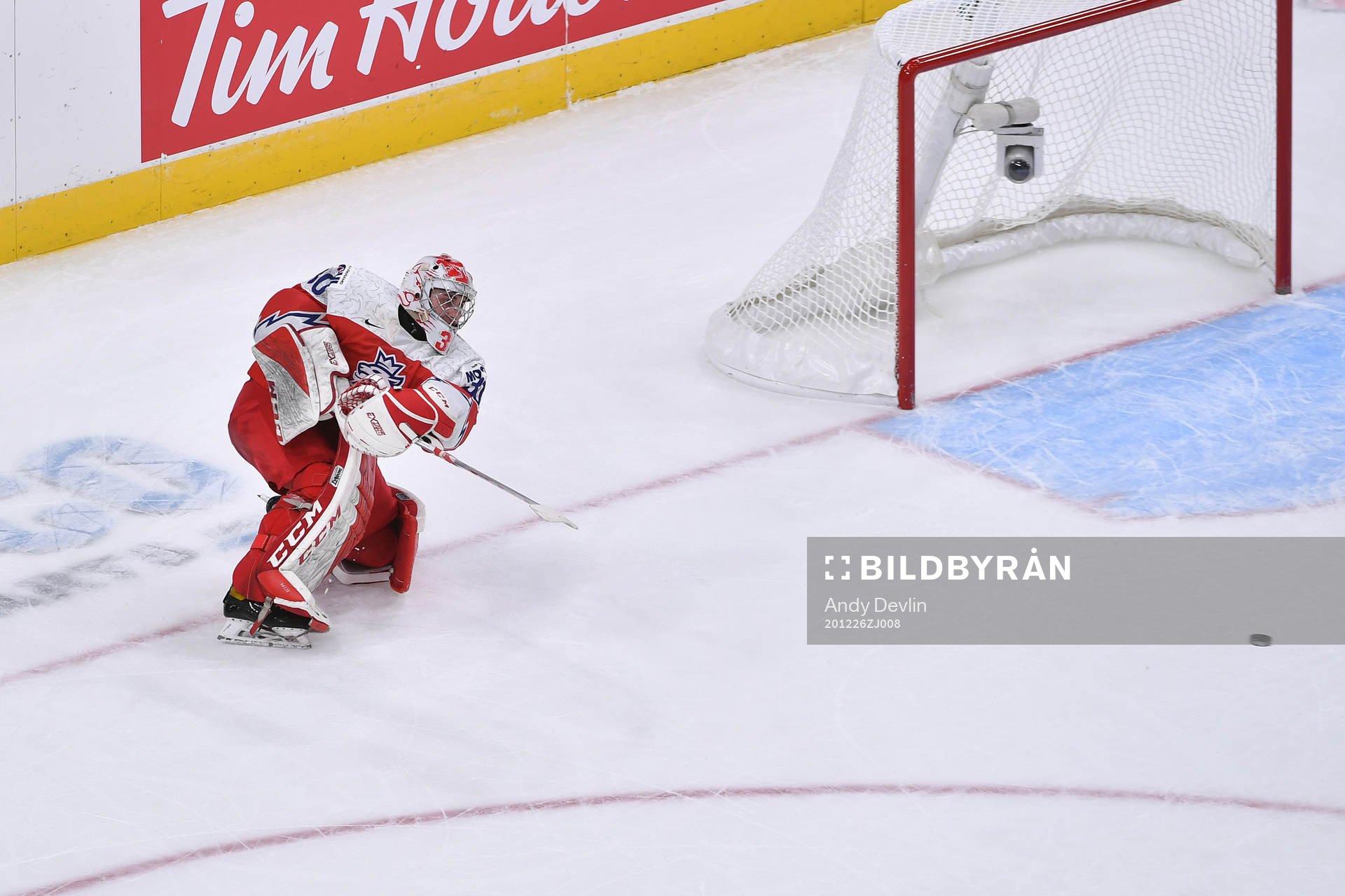 Nick Malik clears the puck
