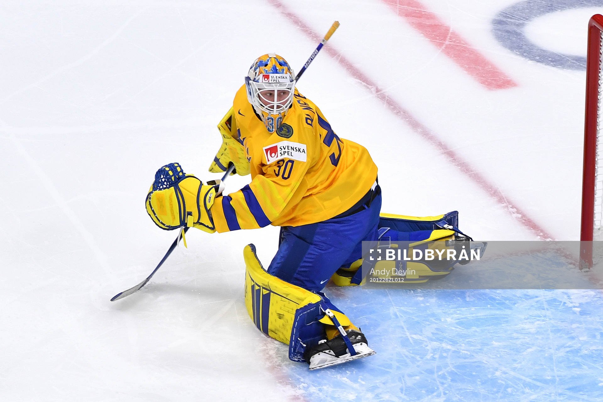 Hugo Alnefelt of Sweden watches the puck go wide of the goal