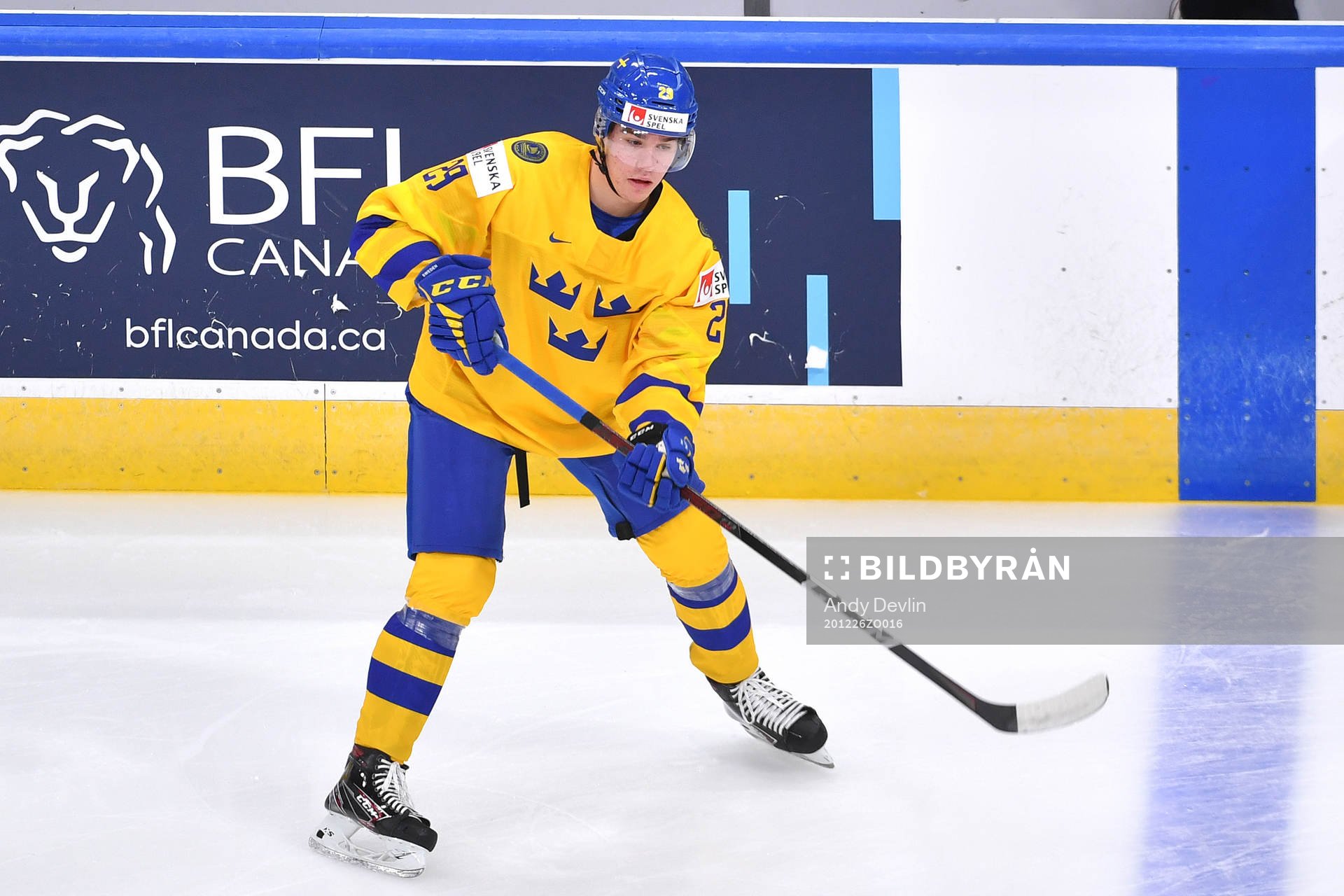 Albin Sundsvik of Sweden passes the puck