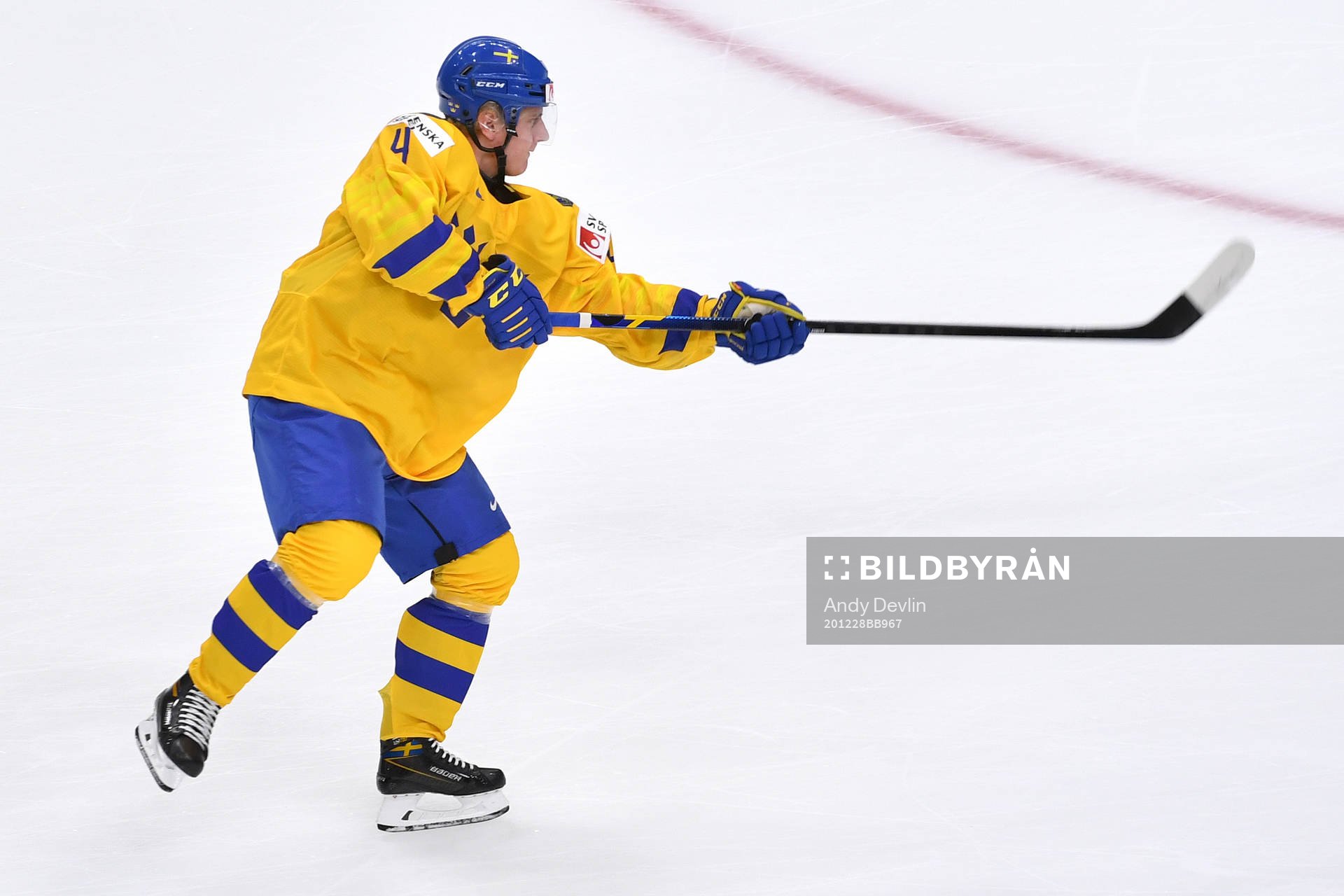 Emil Andrae of Sweden shoots the puck