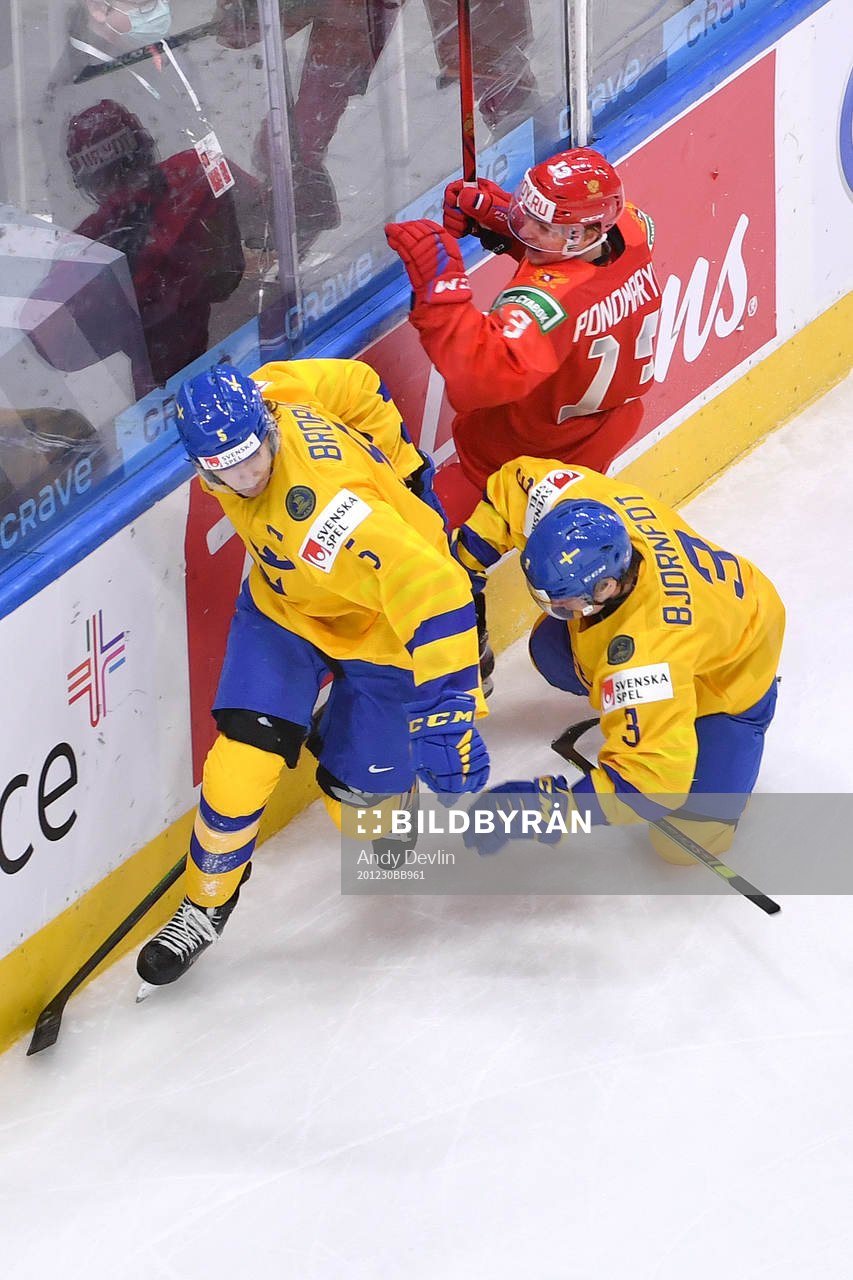 Tobias Björnfot and Philip Broberg of Sweden collide with