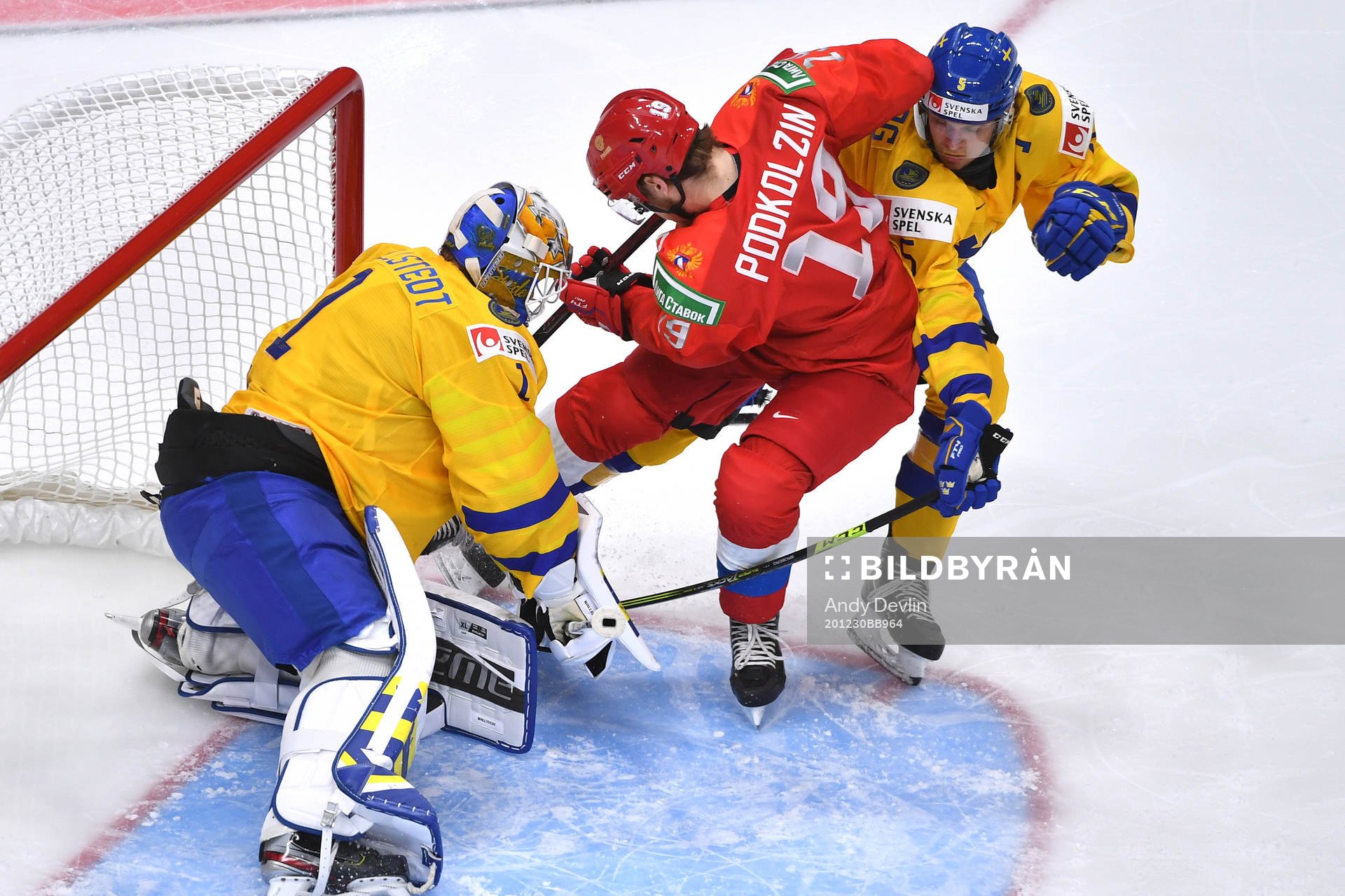 Vasili Podkolzin of Russia crashes the net