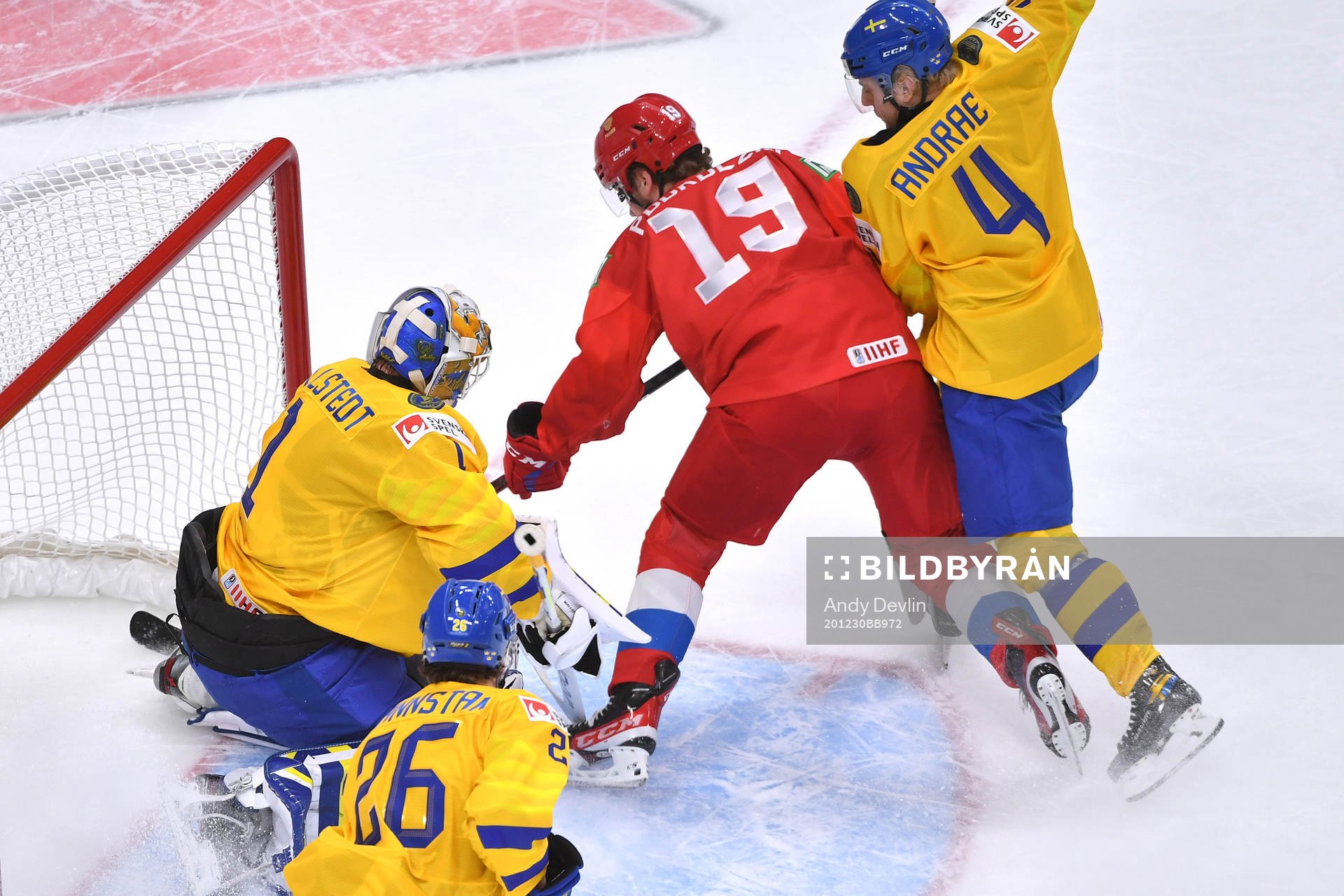 Vasili Podkolzin of Russia crashes the net