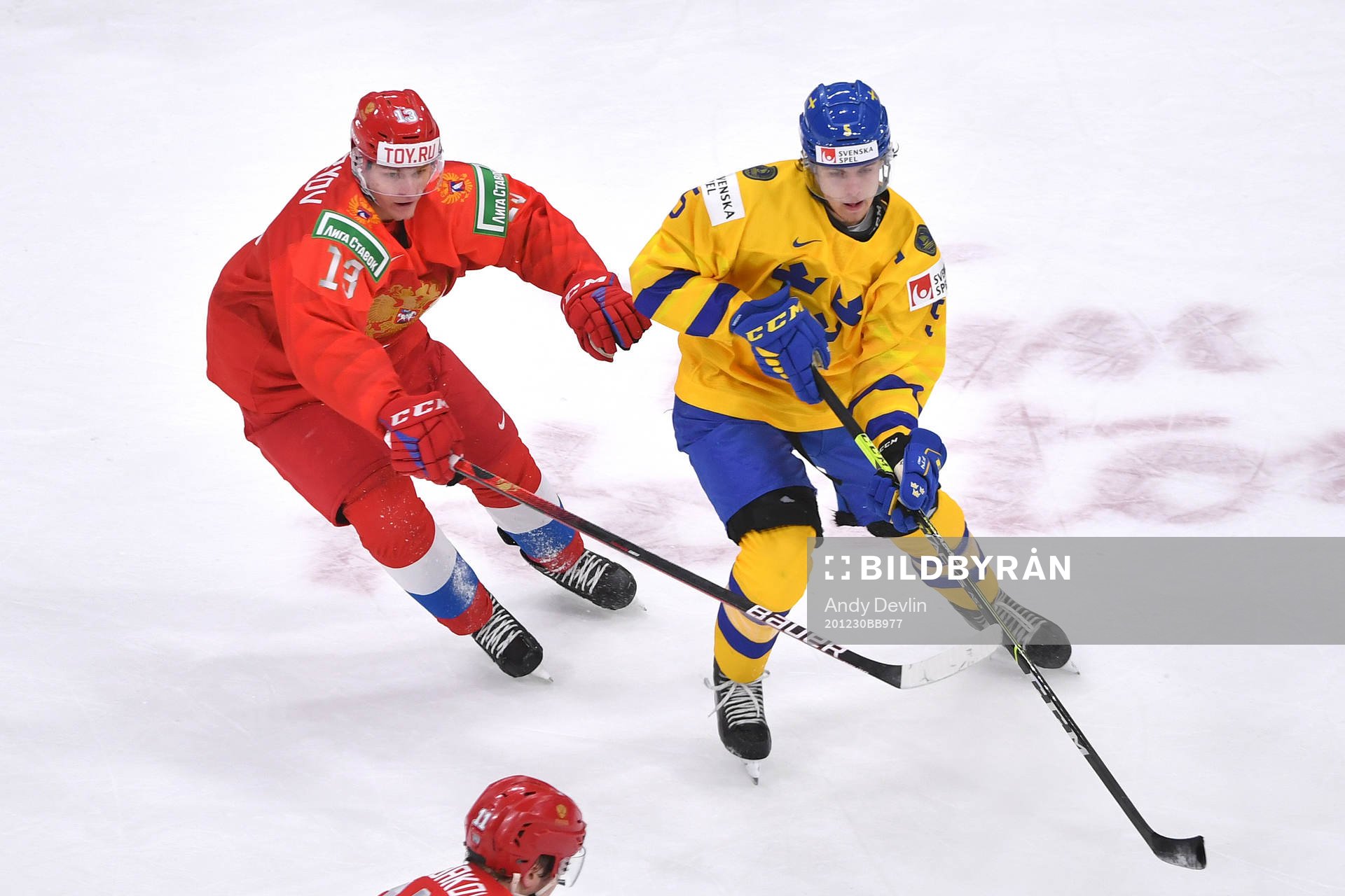 Philip Broberg of Sweden guards the puck from Vasili