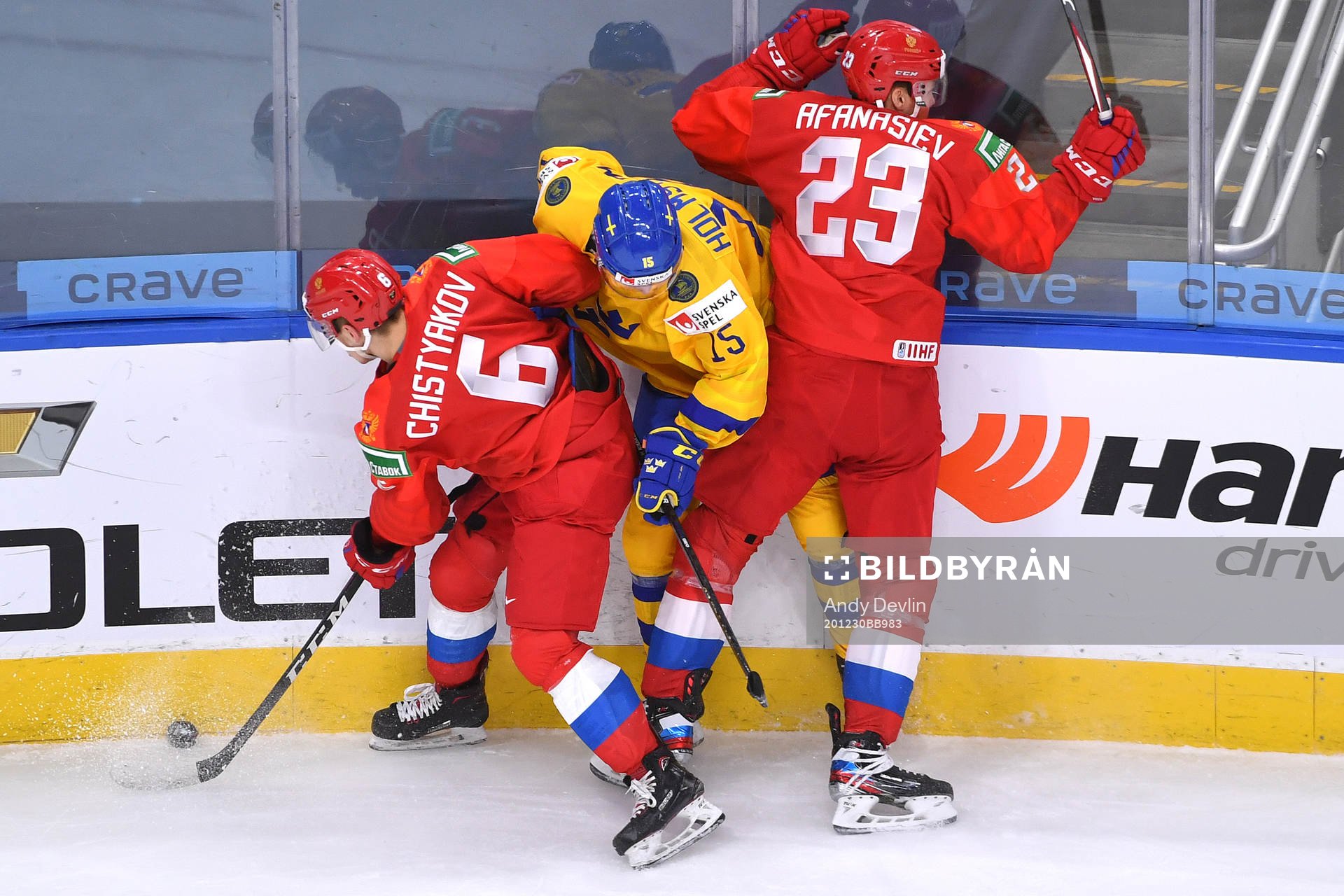 Simon Holmström of Sweden collides with Semyon Chistyakov