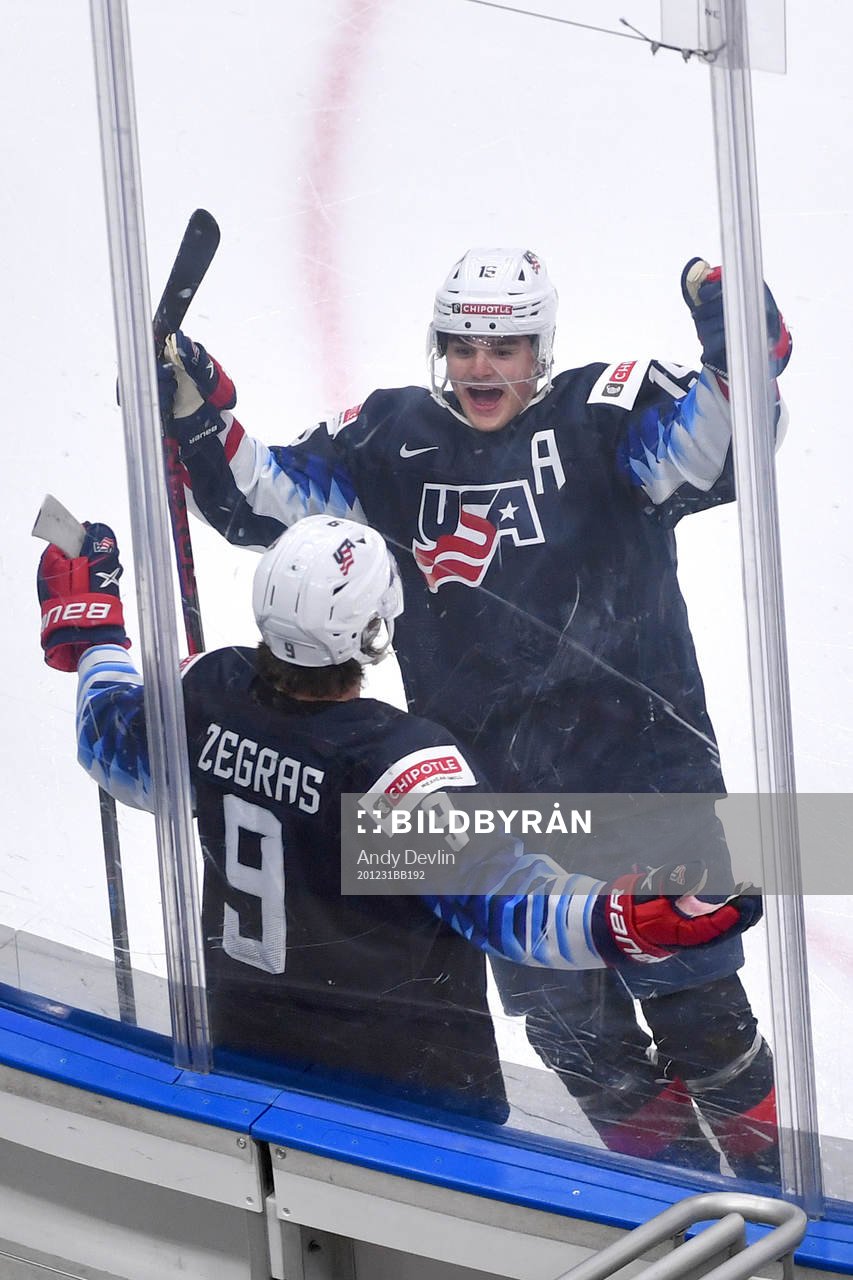 Trevor Zegras and Alex Turcotte of USA celebrate the 2-0