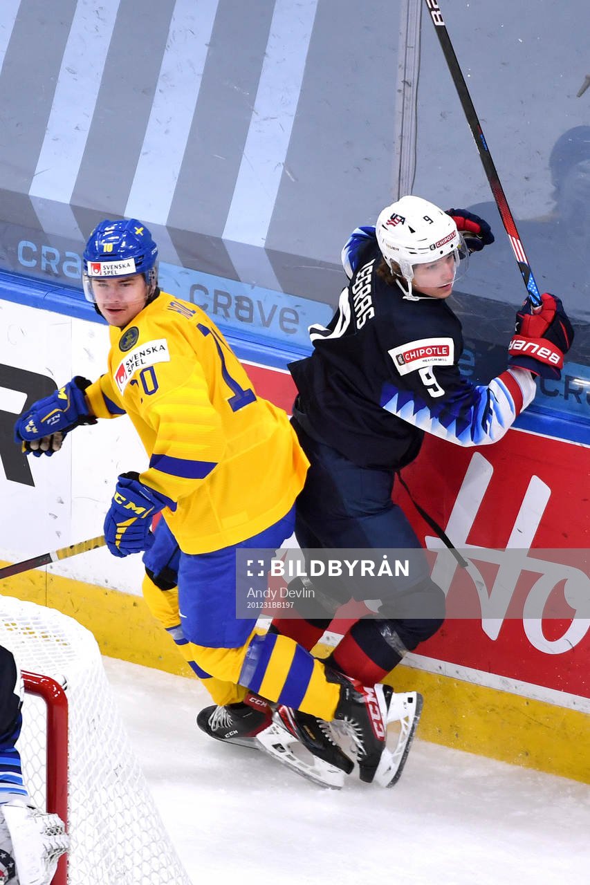 Trevor Zegras of USA and Alexander Holtz of Sweden collide