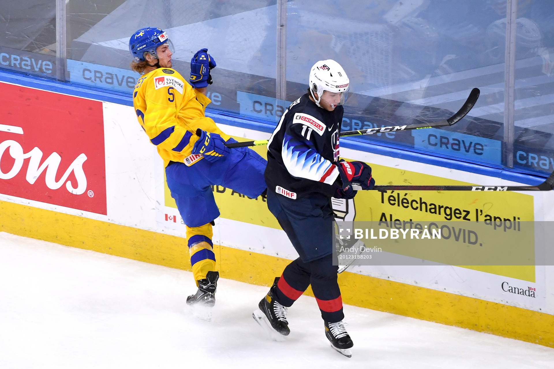 Brock Faber of USA and Philip Broberg of Sweden  collide