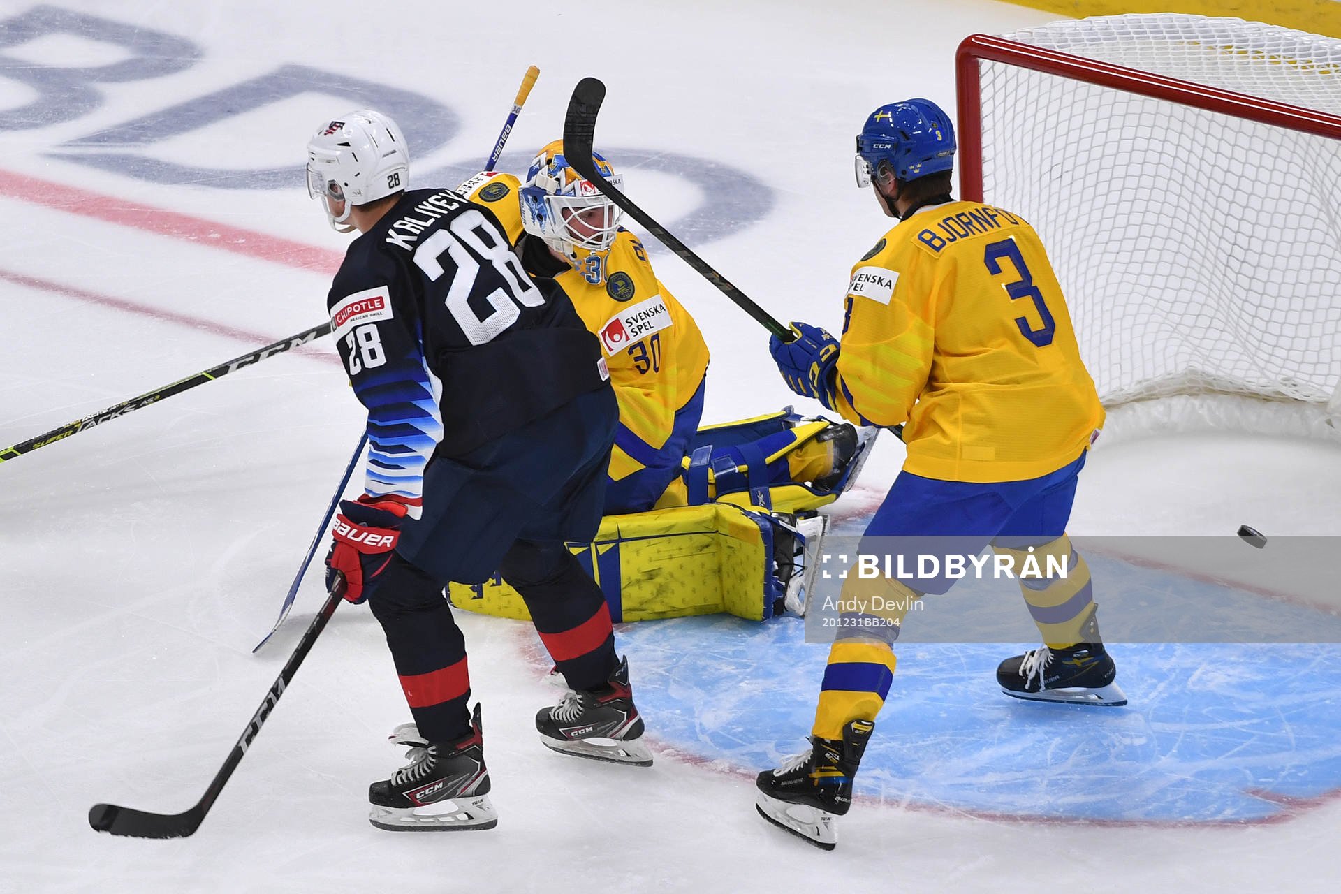 Hugo Alnefelt of Sweden watches the puck go in the net