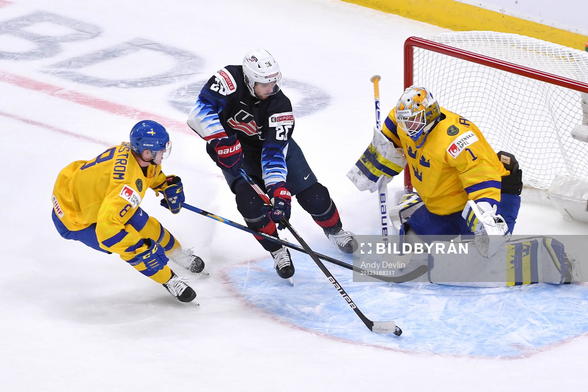 Landon Slaggert of USA skates the puck through the crease