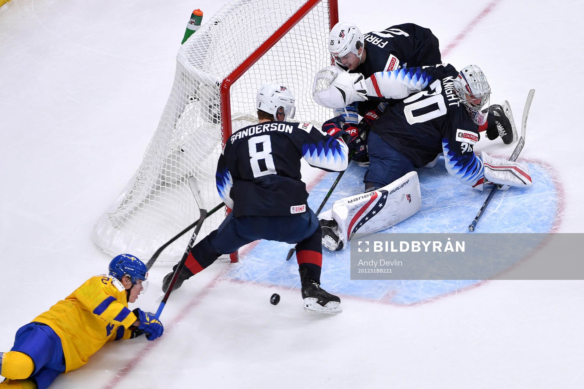 Elmer Söderblom of Sweden tries a wraparound while Spencer