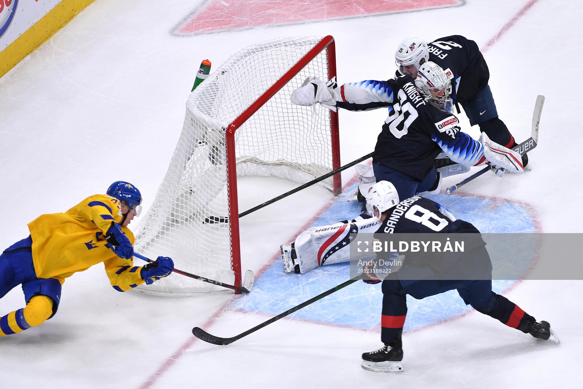 Elmer Söderblom of Sweden tries a wraparound while Spencer