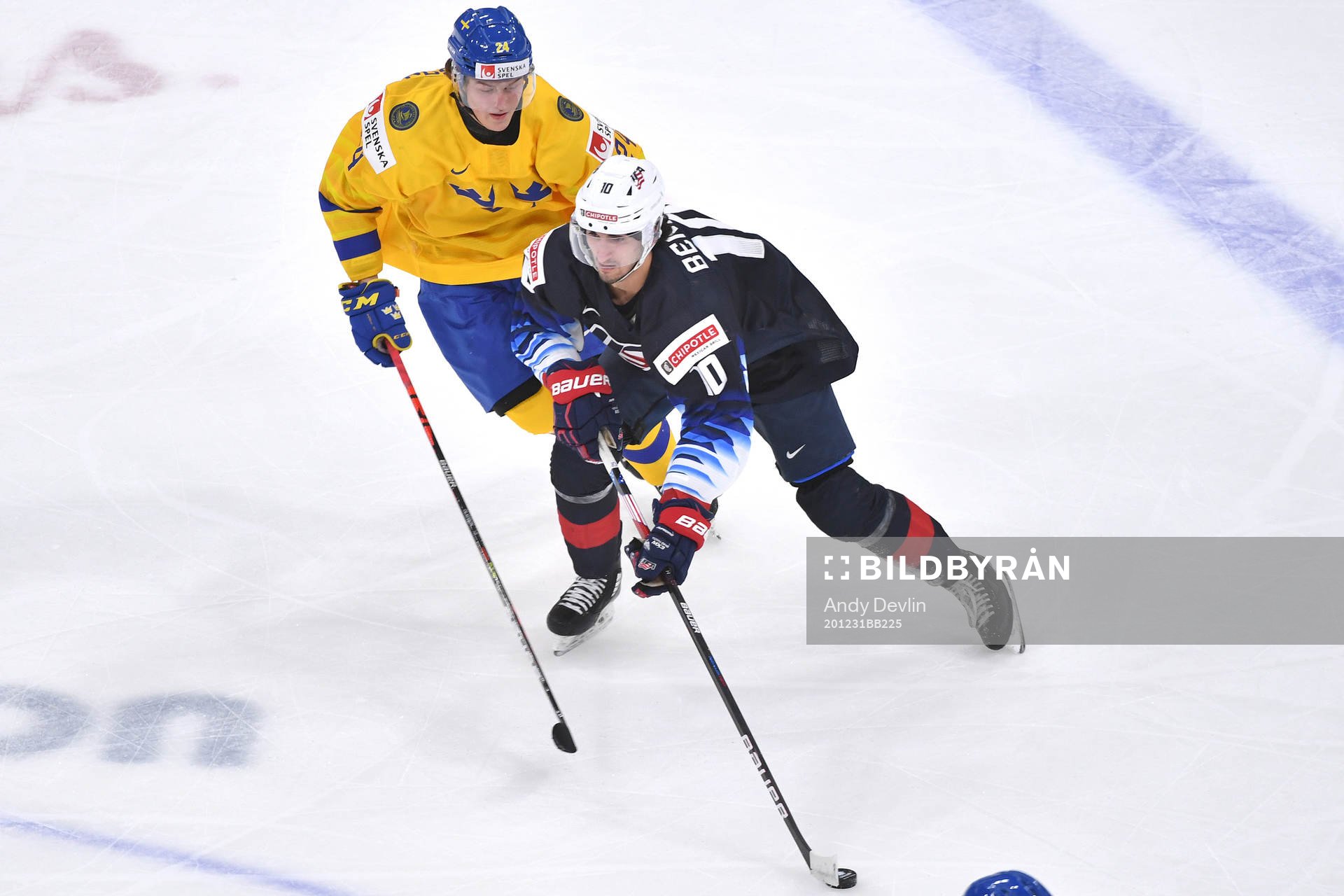 Oskar Olausson of Sweden pursues Matthew Beniers of USA