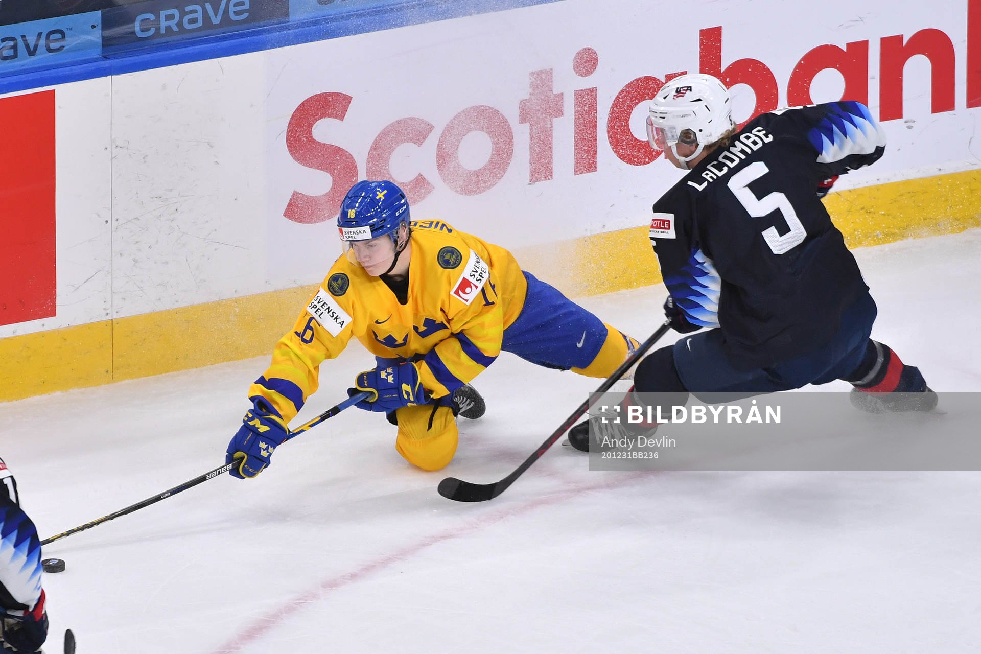 Theodor Niederbach of Sweden reaches for the puck while
