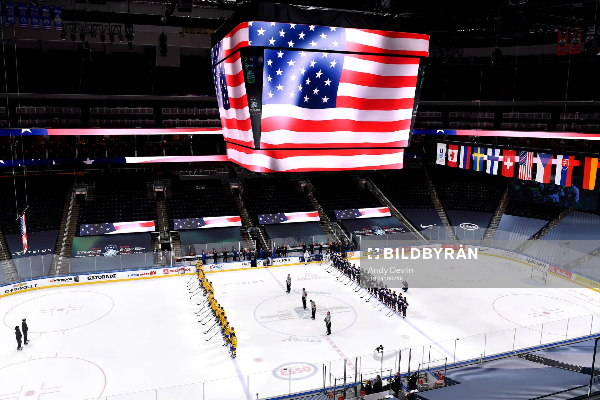 Team USA and Team Sweden stand for the playing of the USA
