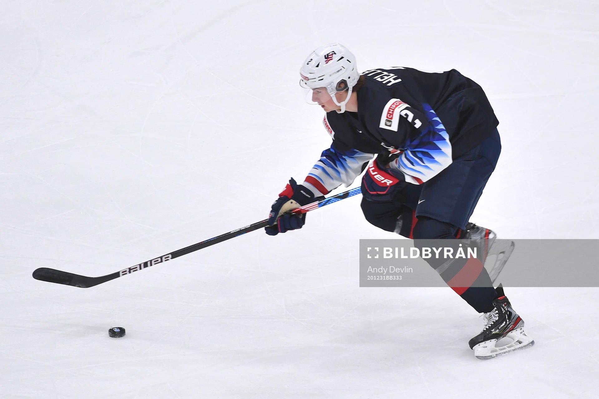 Drew Helleson of USA skates with the puck