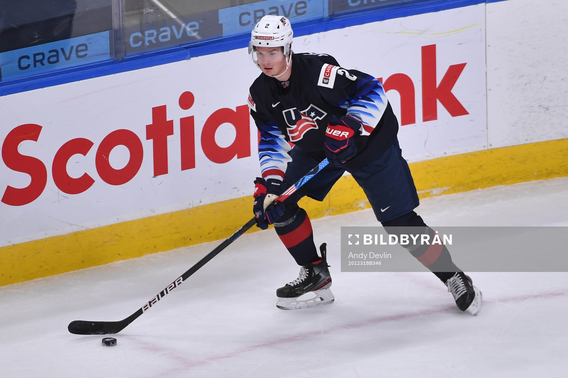 Drew Helleson of USA skates with the puck