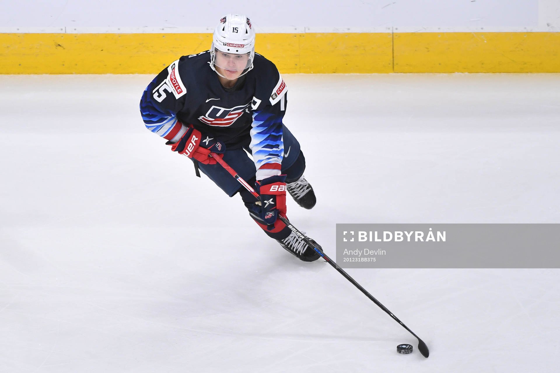 Alex Turcotte of USA skates with the puck