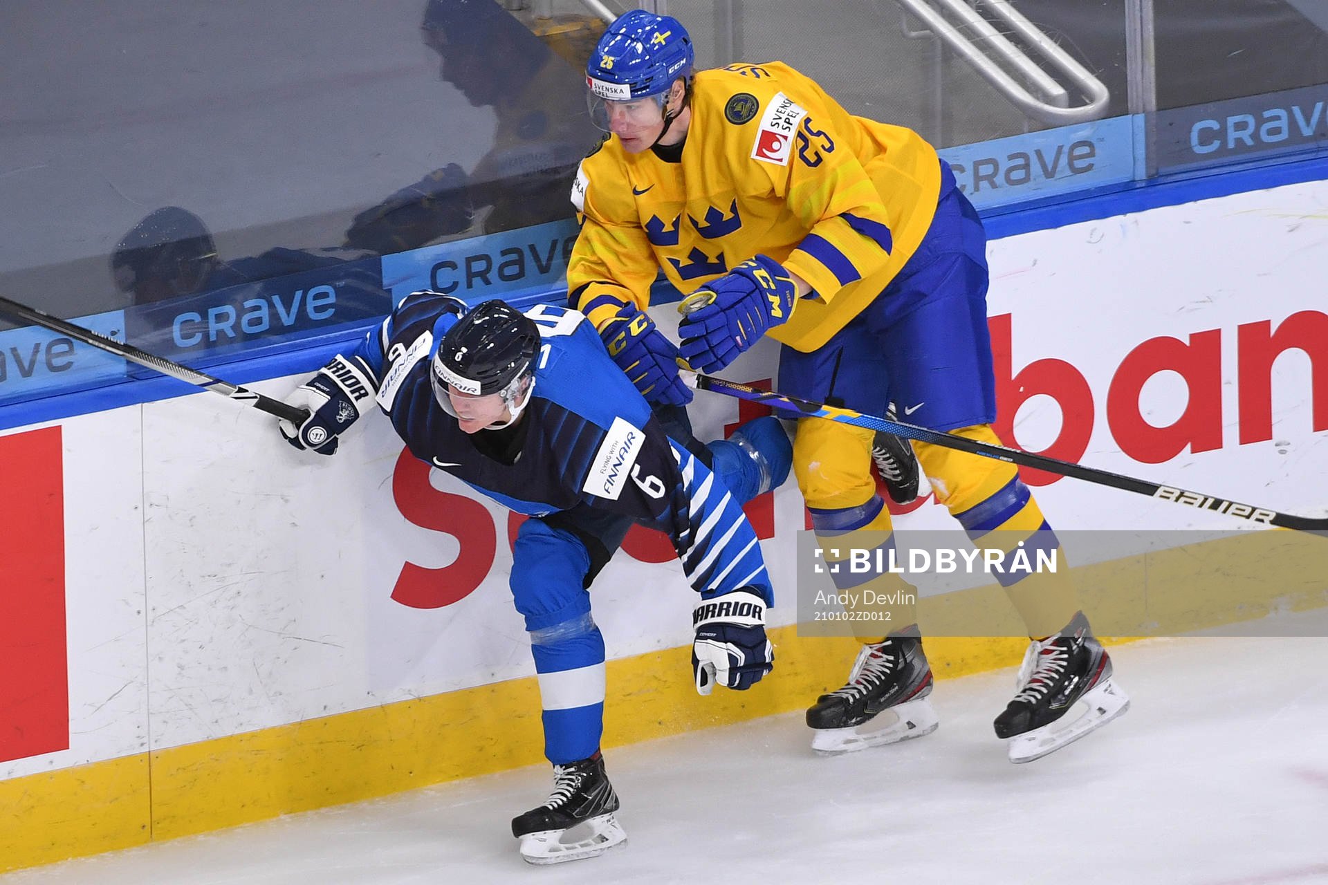 Elmer Söderblom of Sweden hits Eemil Viro of Finland
