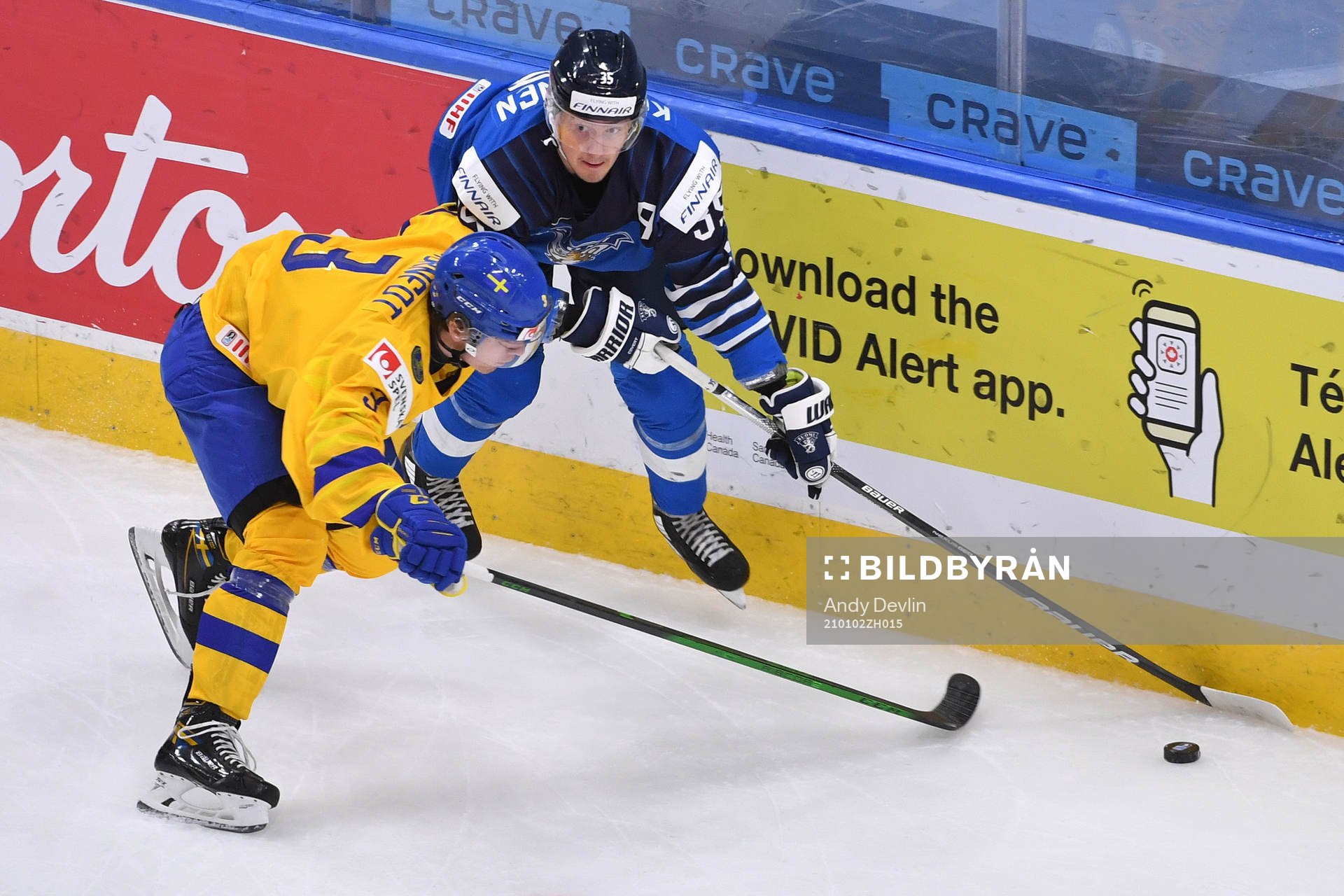 Tobias Björnfot of Sweden collides with Mikko Kokkonen of