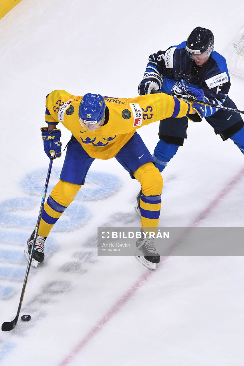 Elmer Söderblom of Sweden uses his body to protect the