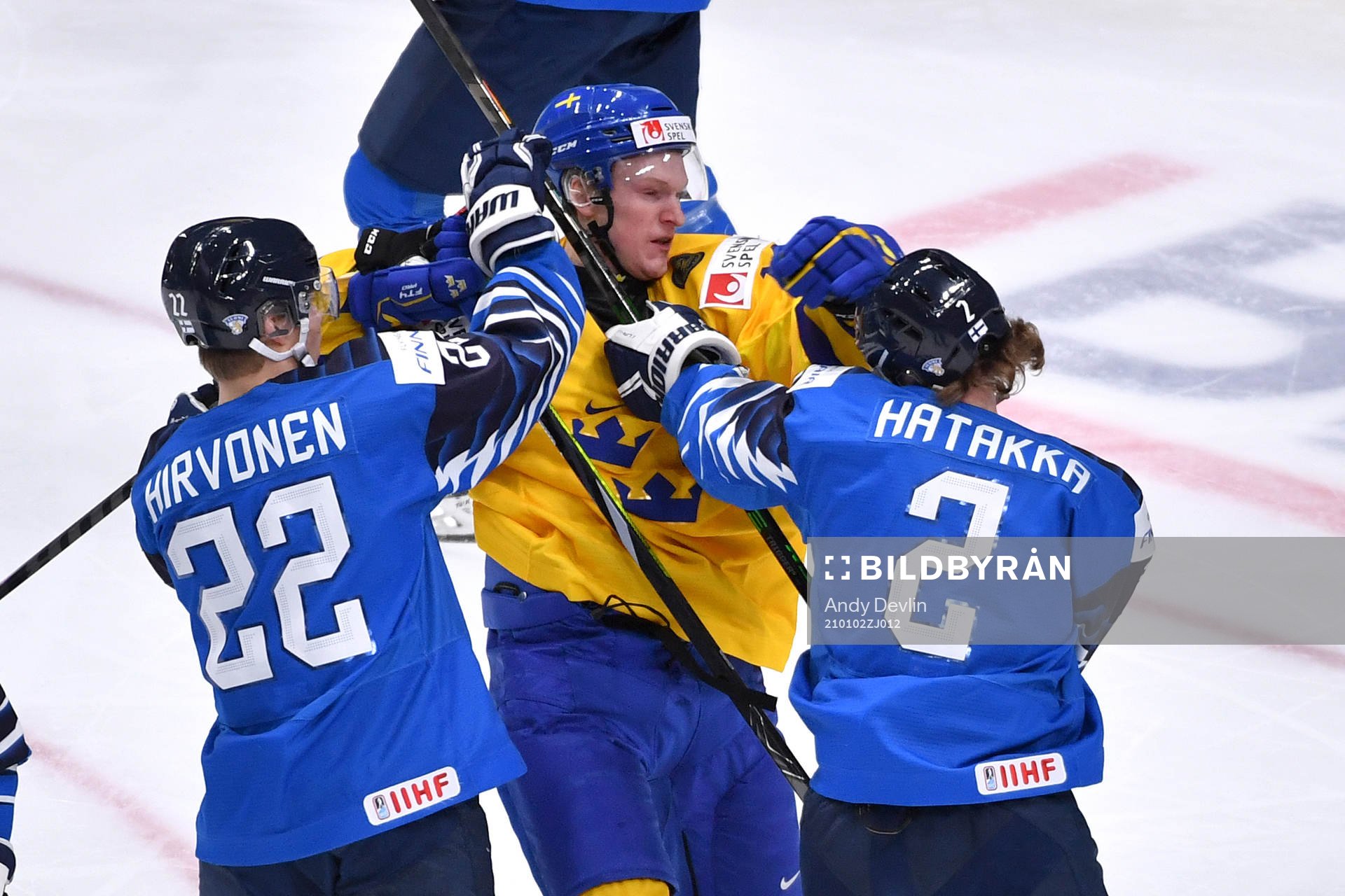 Oskar Kvist of Sweden battles with Santeri Hatakka and Roni